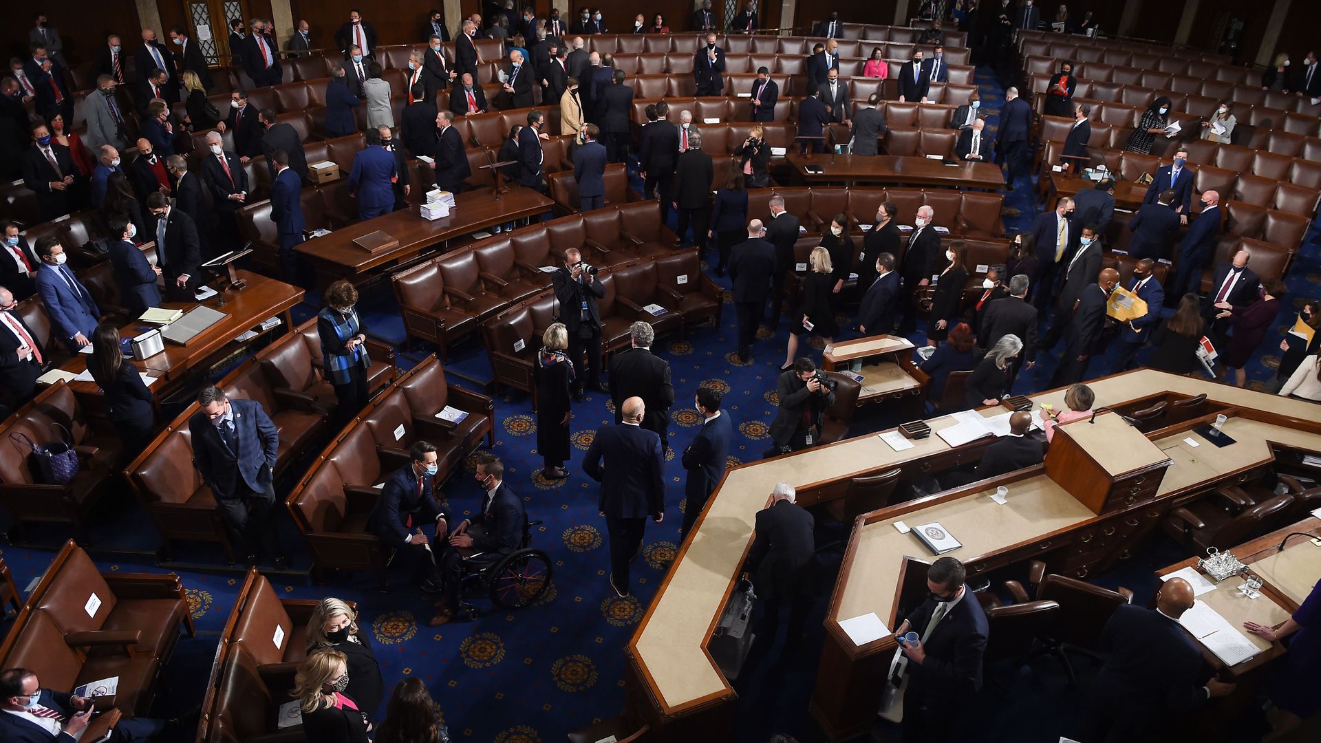Lawmakers in Congress on Jan. 6 before being evacuated from the chamber as Trump supporters storm the Capitol Building.