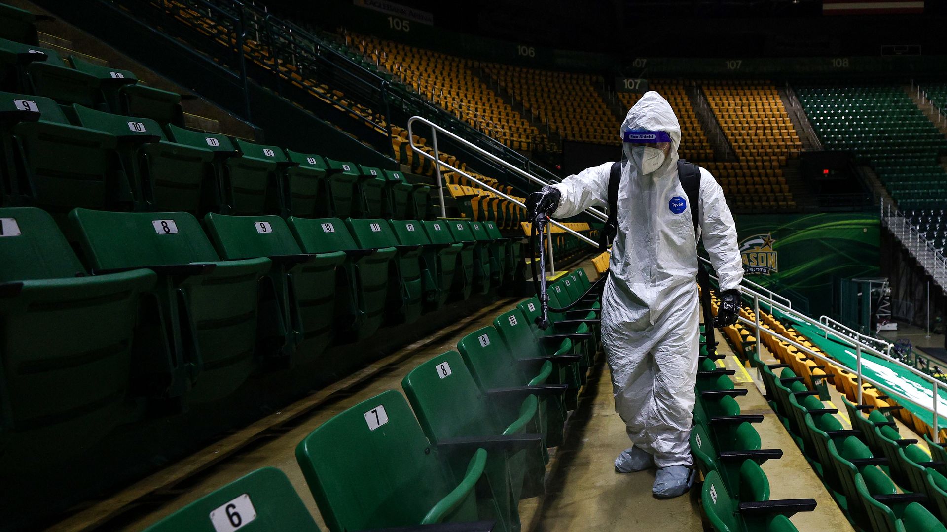 A person sanitizing seats at George Mason University in Fairfax, Virginia, in January 2021.