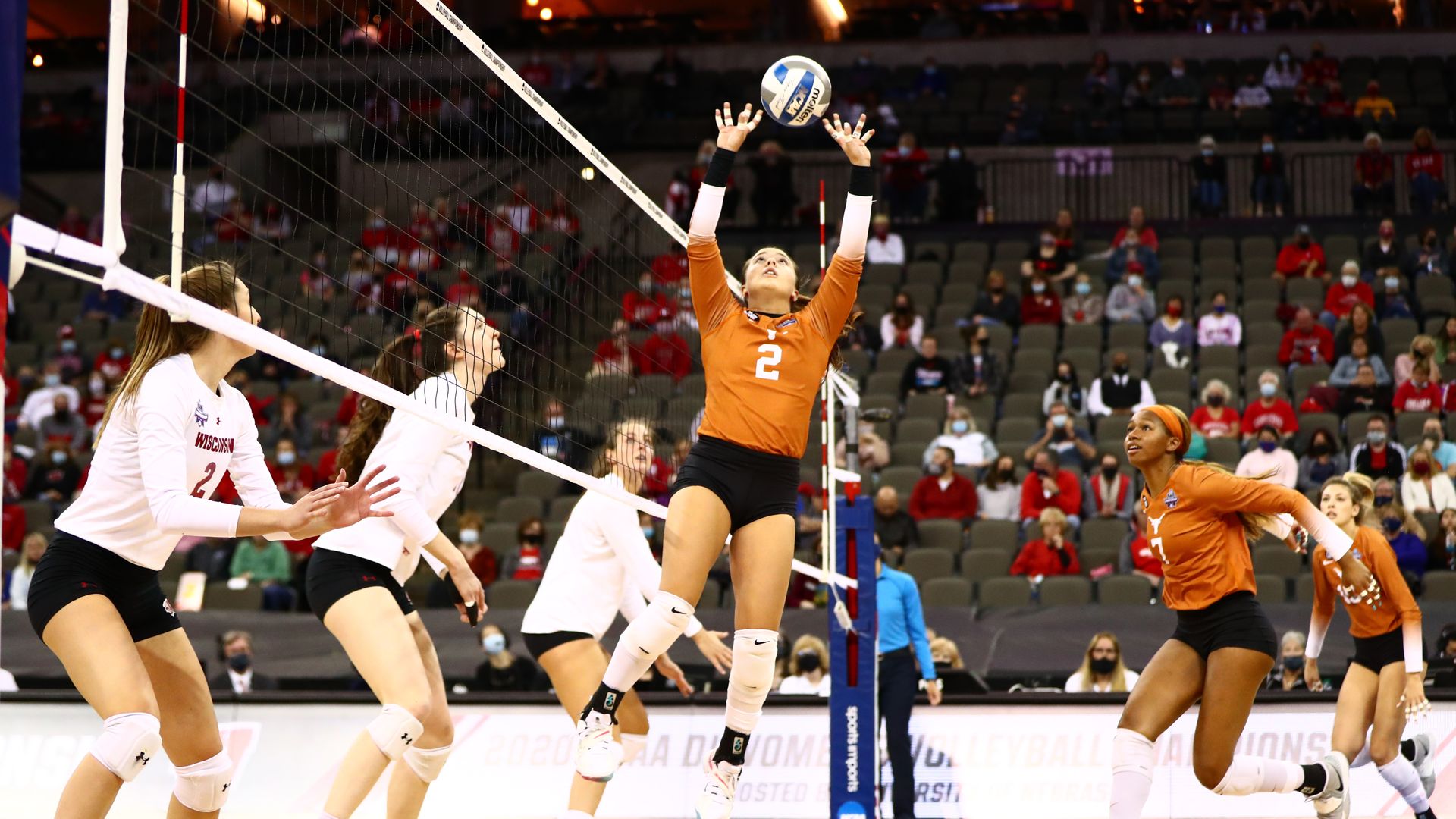University of Texas athletes play volleyball