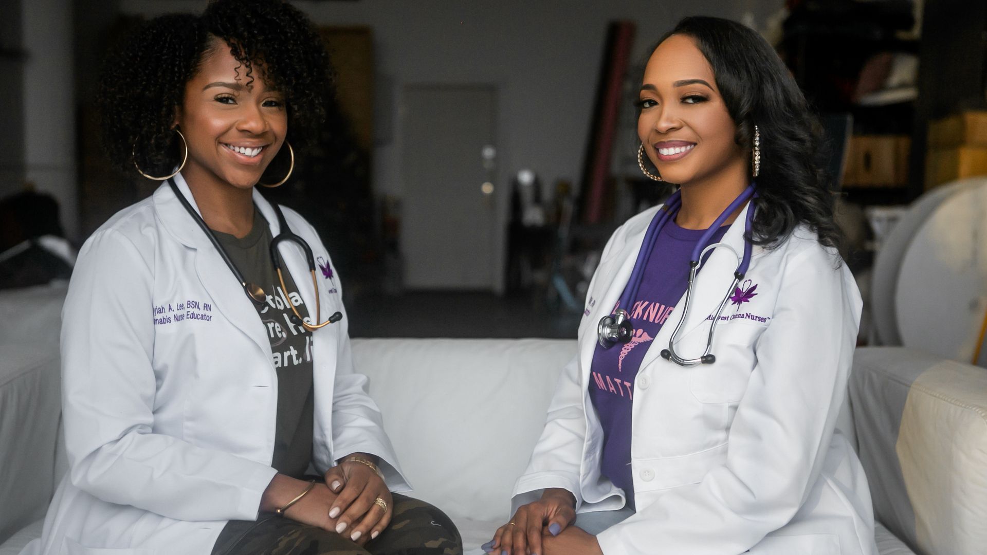 The two founders of Midwest CannaNurses sit in their white coats 