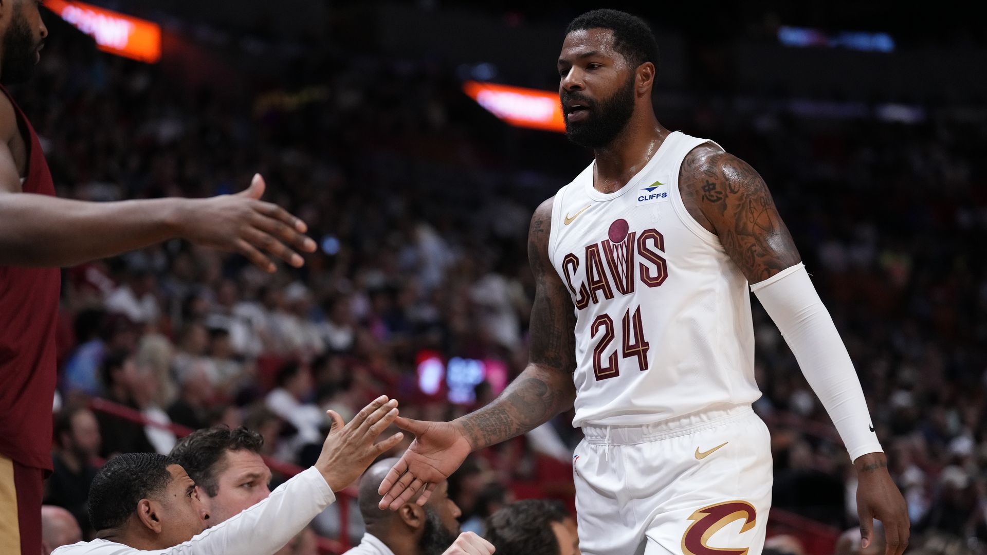 The Cavs' Marcus Morris (white jersey) heads to the bench. 
