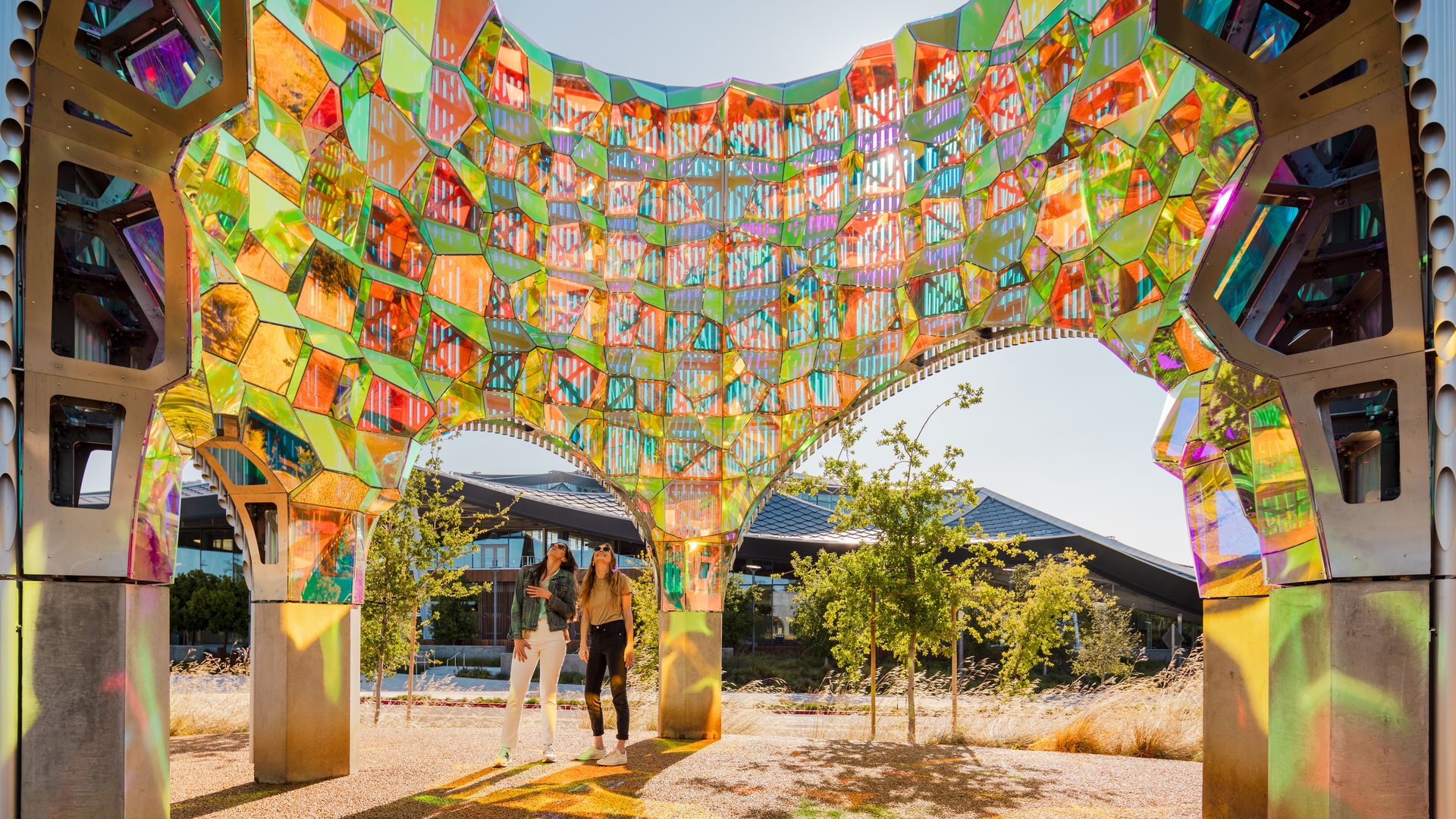 Photo of a towering outdoor stained glass art installation 