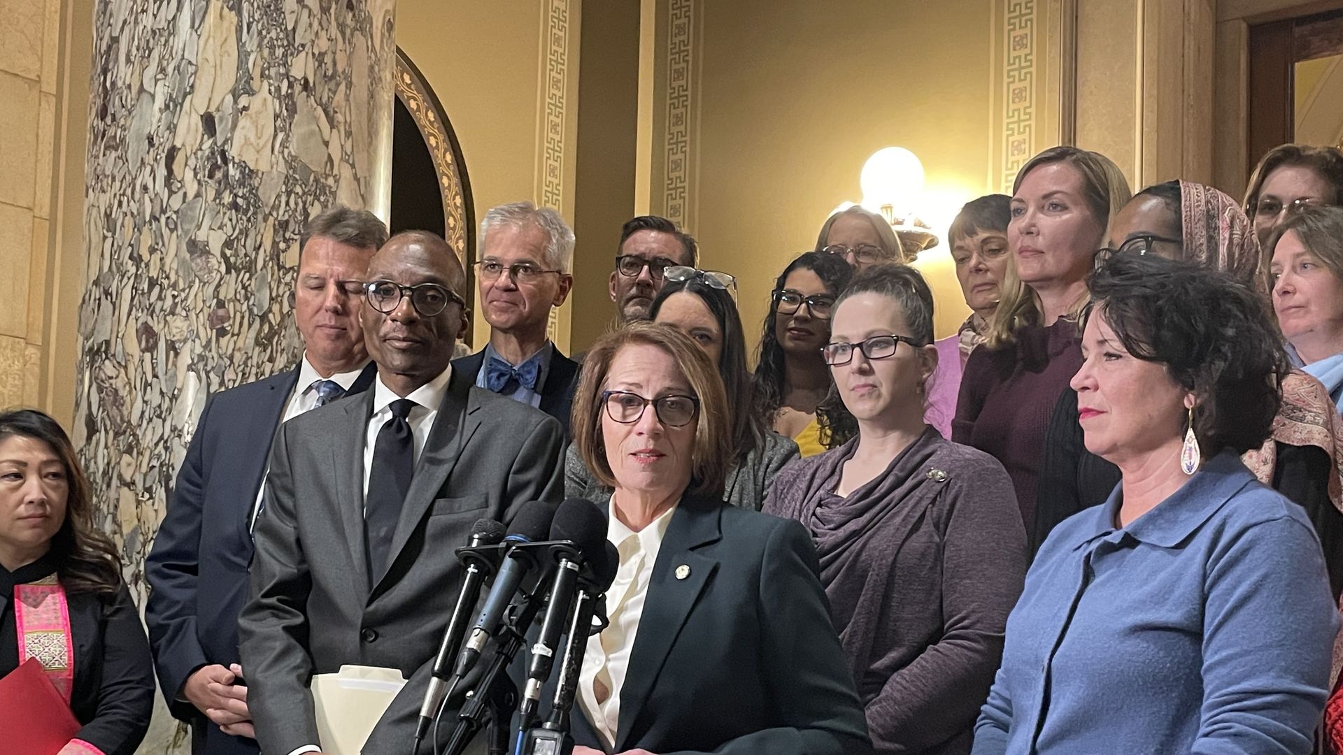 Sen. Erin Murphy surrounded by other members of the Senate.