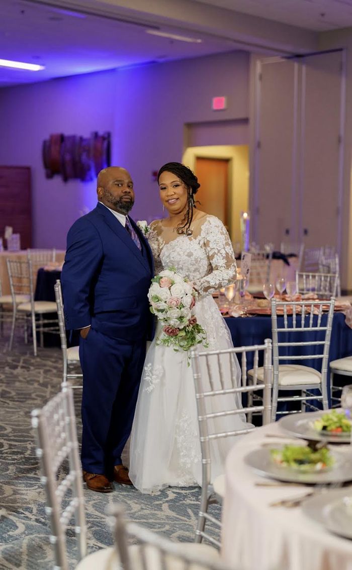 Rhiannon Ward (right) and her husband at their wedding reception. 
