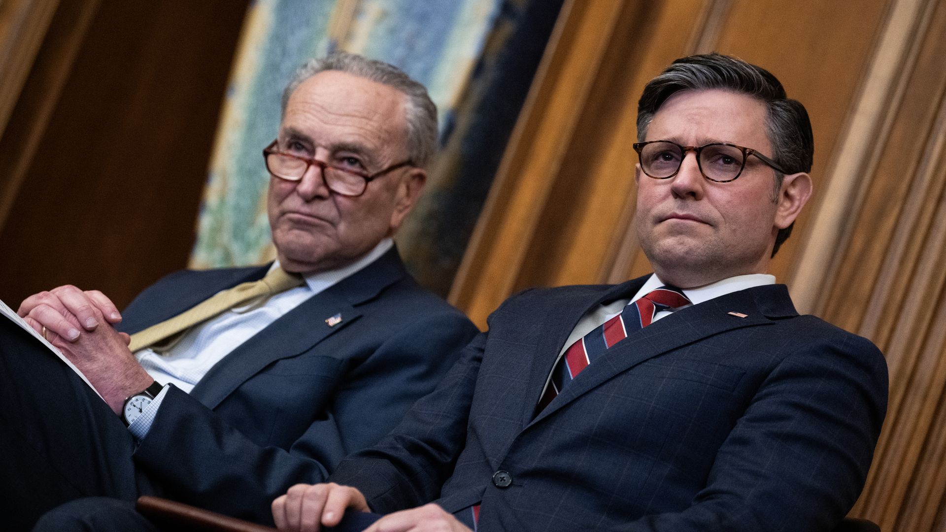UNITED STATES - DECEMBER 12: Senate Majority Leader Charles Schumer, D-N.Y., left, and Speaker of the House Mike Johnson, R-La., attend a Menorah lighting to celebrate the eight-day festival of Hanukkah, in the U.S. Capitol 