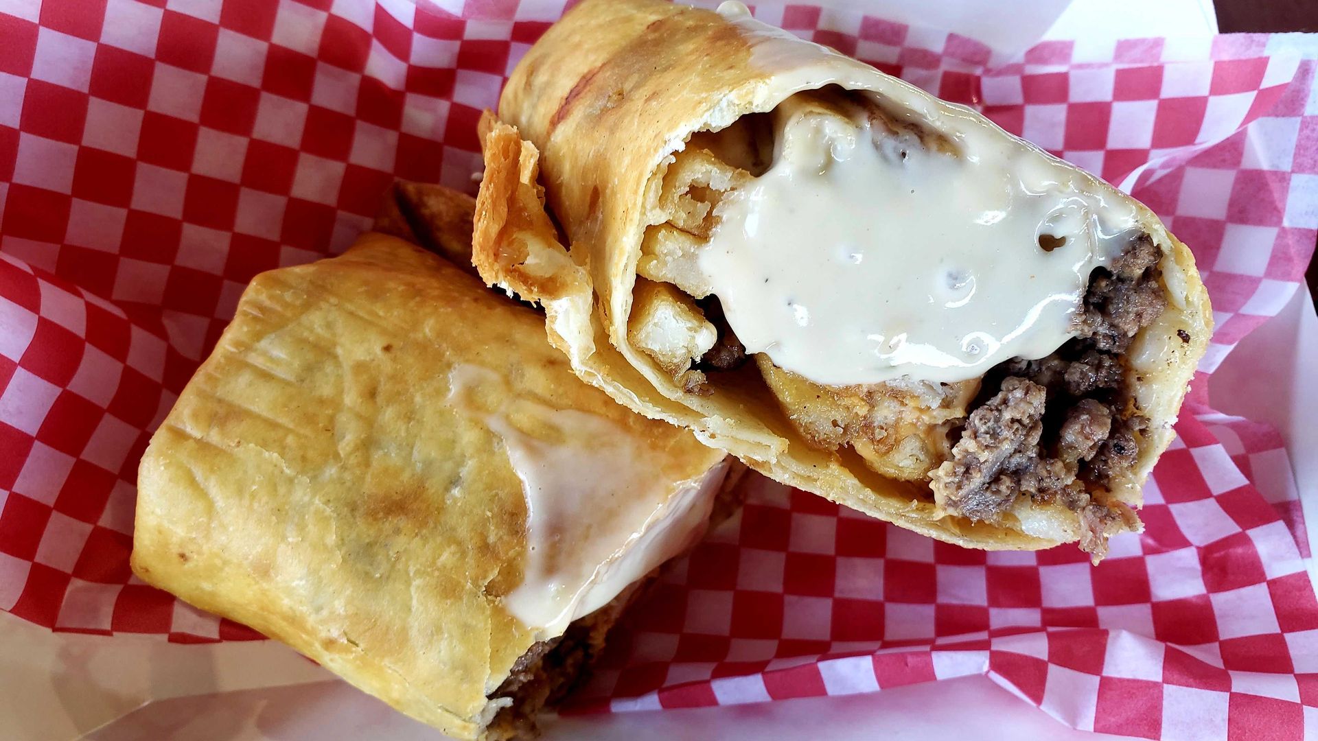 Photo of a sandwich wrap in a basket.