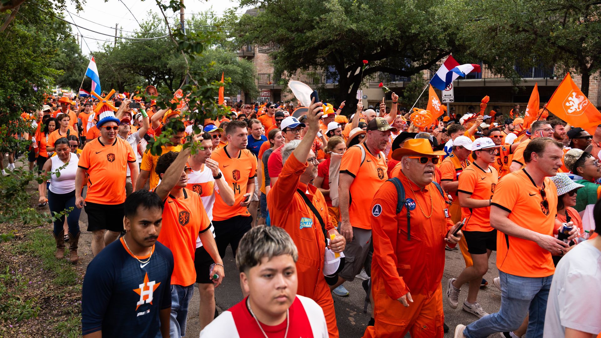 A crowd of people in orange. 