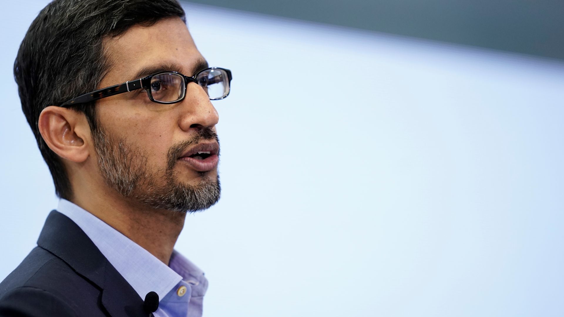 In this image, Google CEO Sindar sundar pichai stands and talks