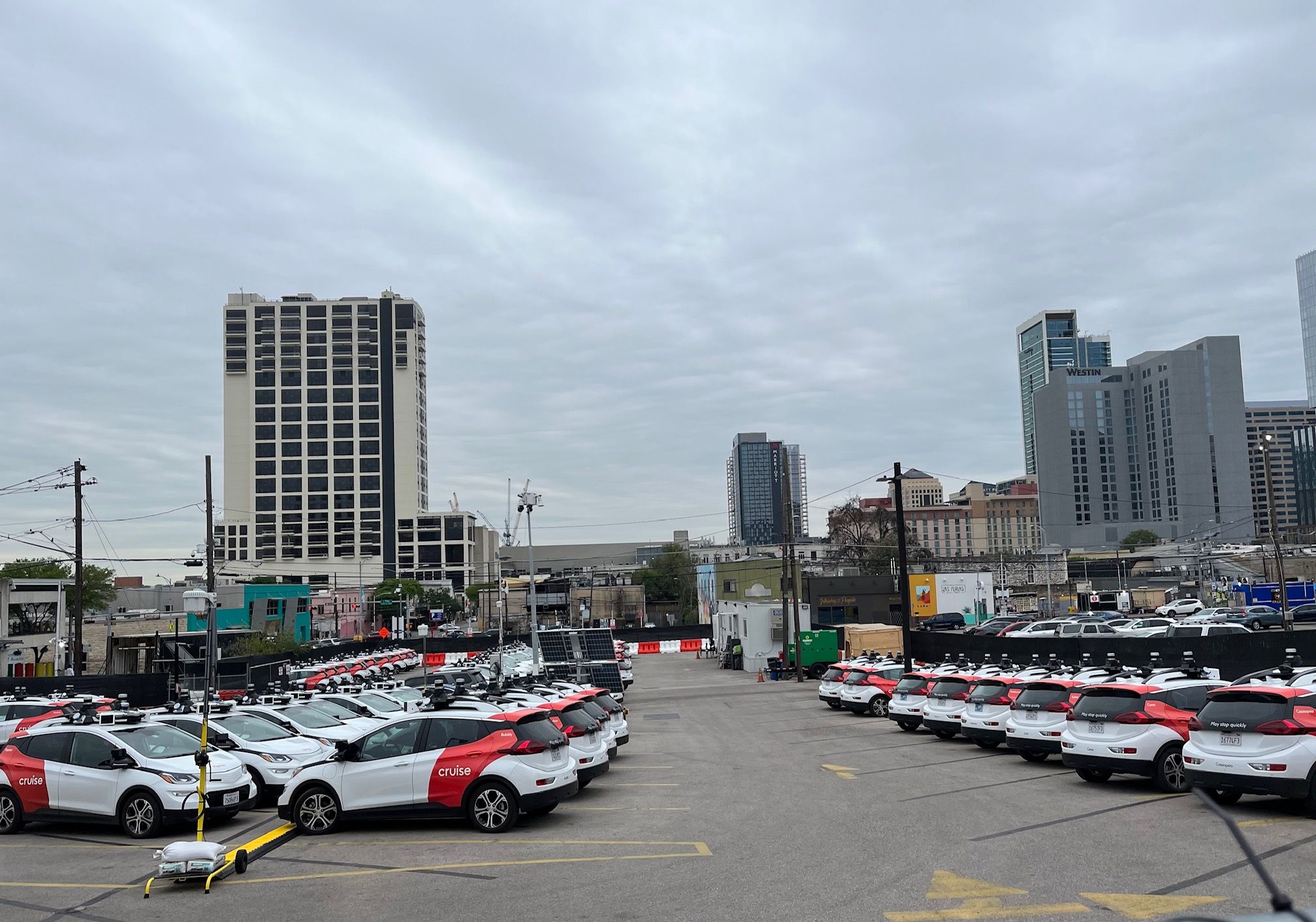 A parking lot full of cars in downtown Austin.