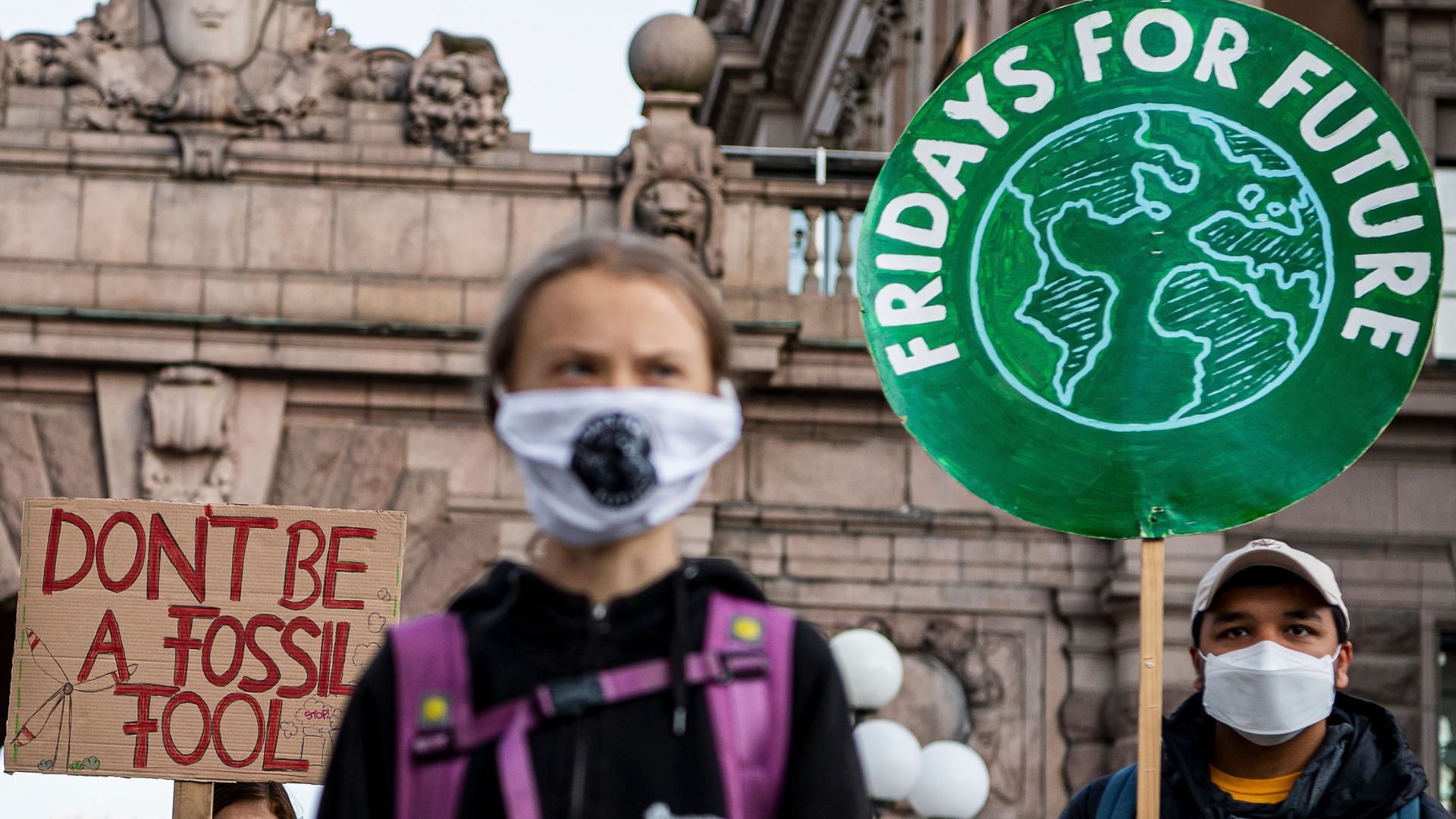 Swedish climate activist Greta Thunberg (C) fronts a Fridays For Future protest at the Swedish Parliament (Riksdagen) in Stockholm on September 25