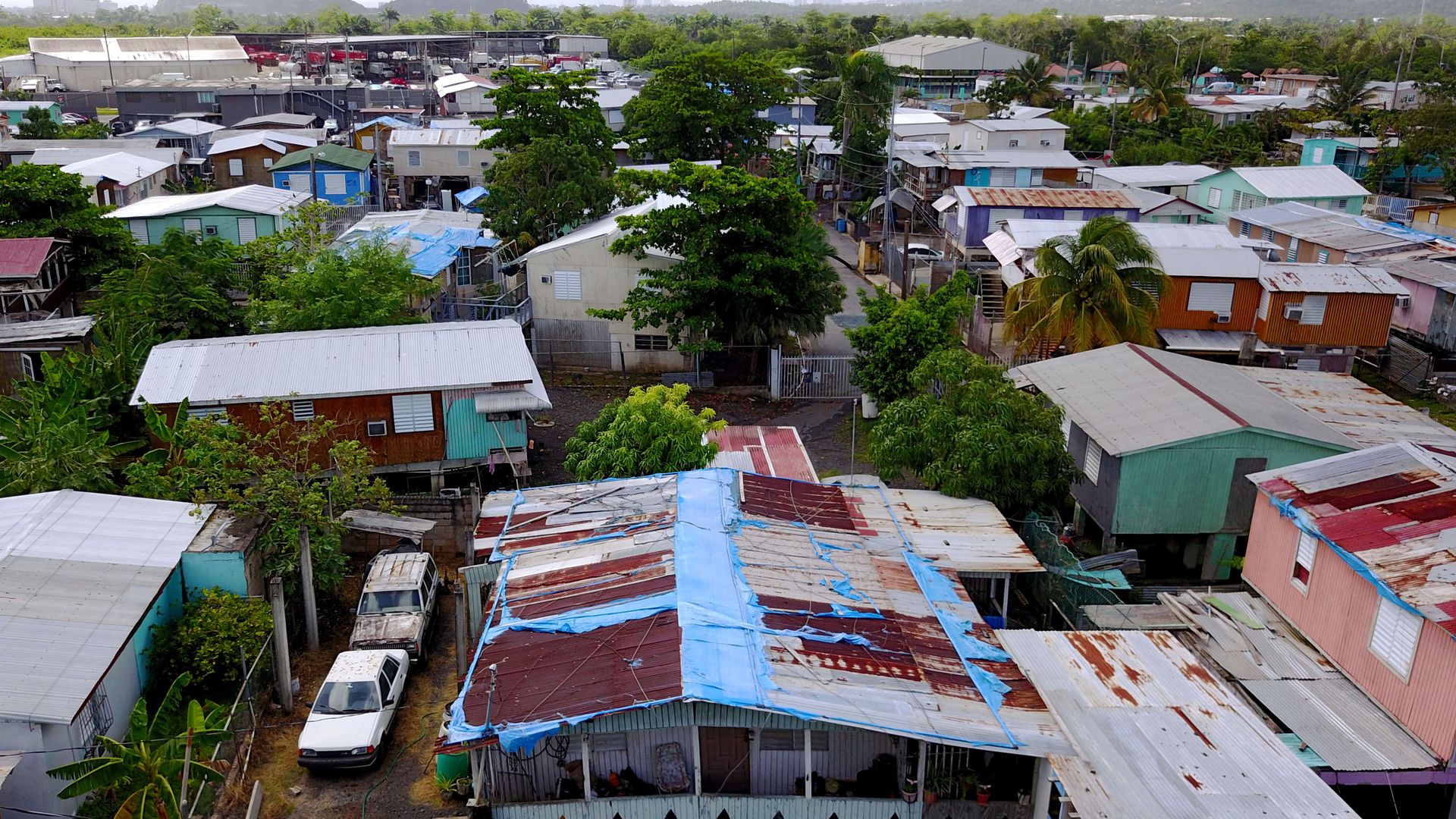 The blue tarp that was used to protect the roof damaged by Hurricane Maria two years ago is showing wear and tear in San Juan, Puerto Rico, September 18