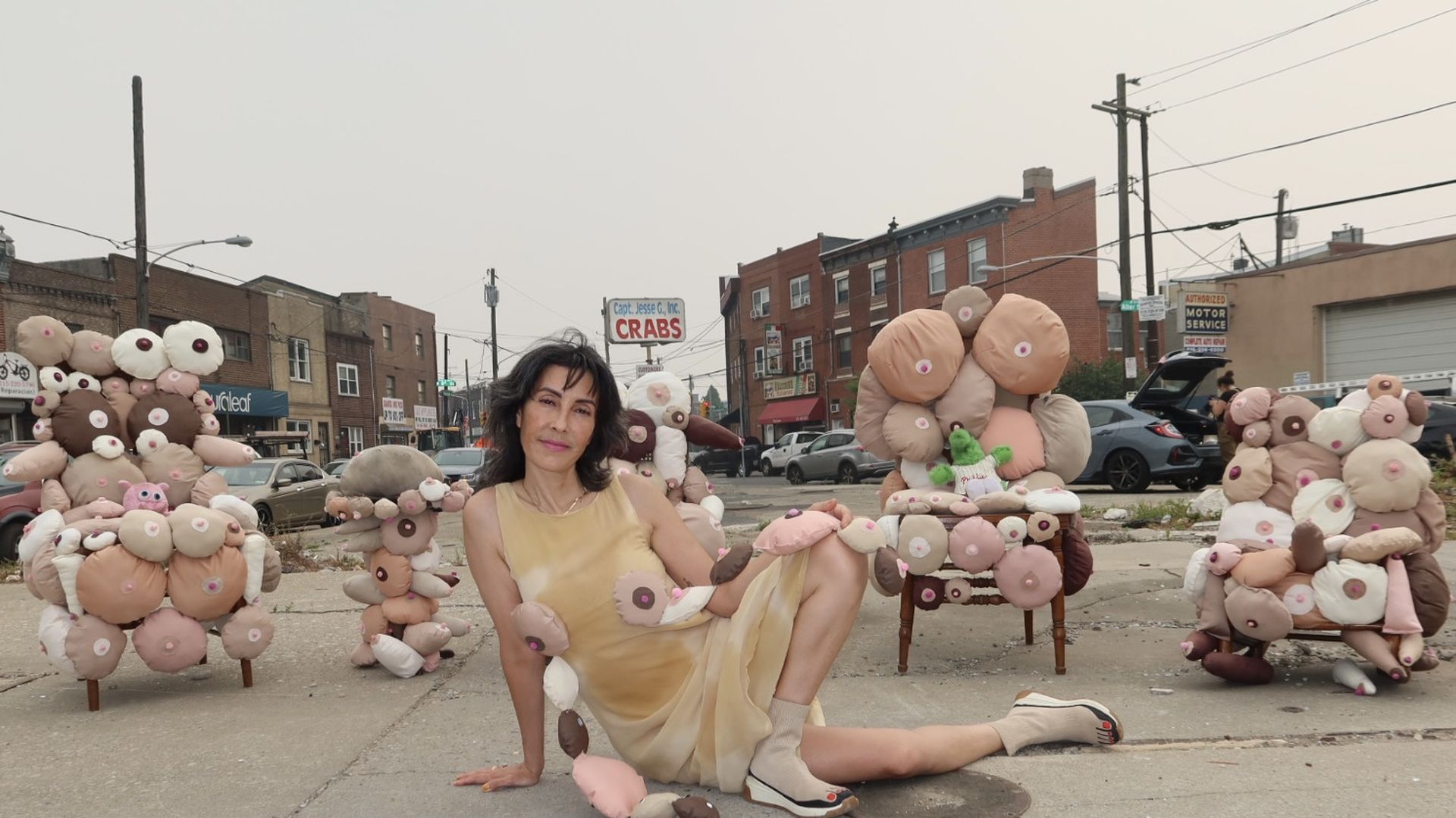 Philly artist Rose Luardo lounges at her "Boob Garden" art popup in Philly.