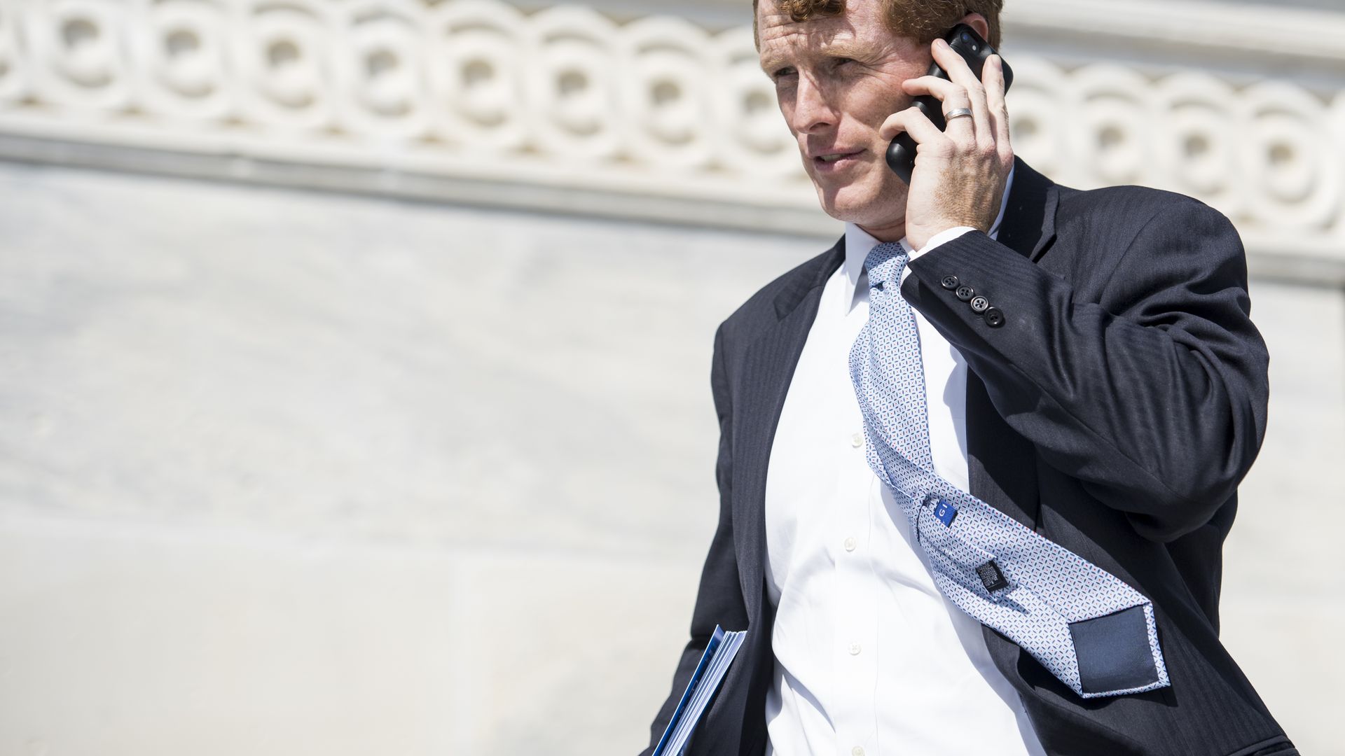 Joe Kennedy talking on the phone