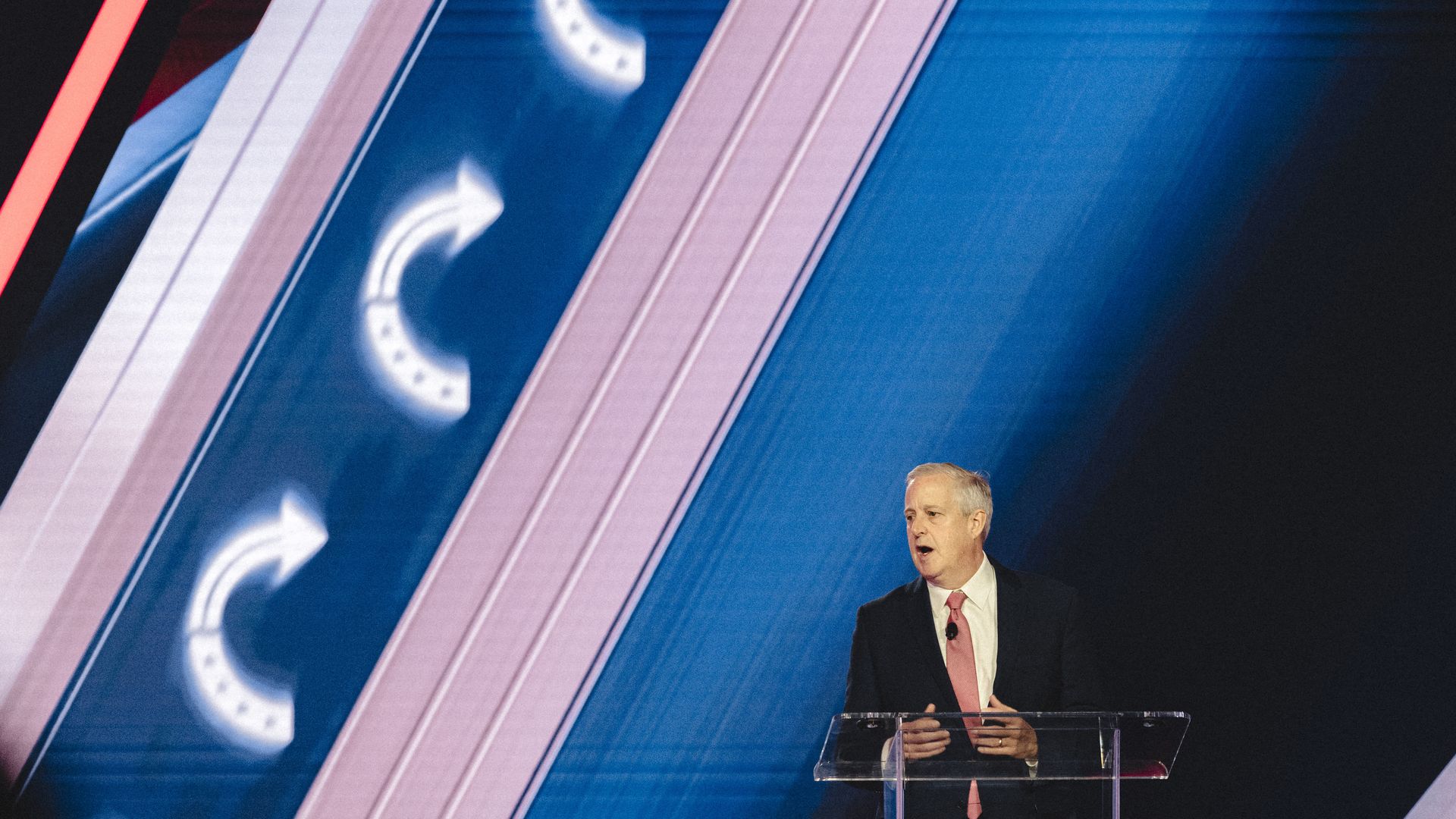 Michael Whatley speaks on stage