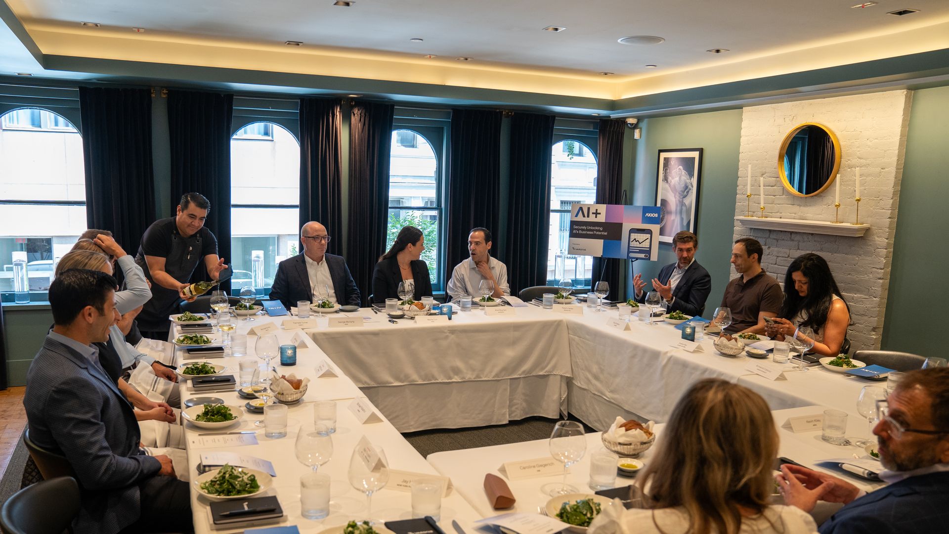 Attendees gathered around the table.