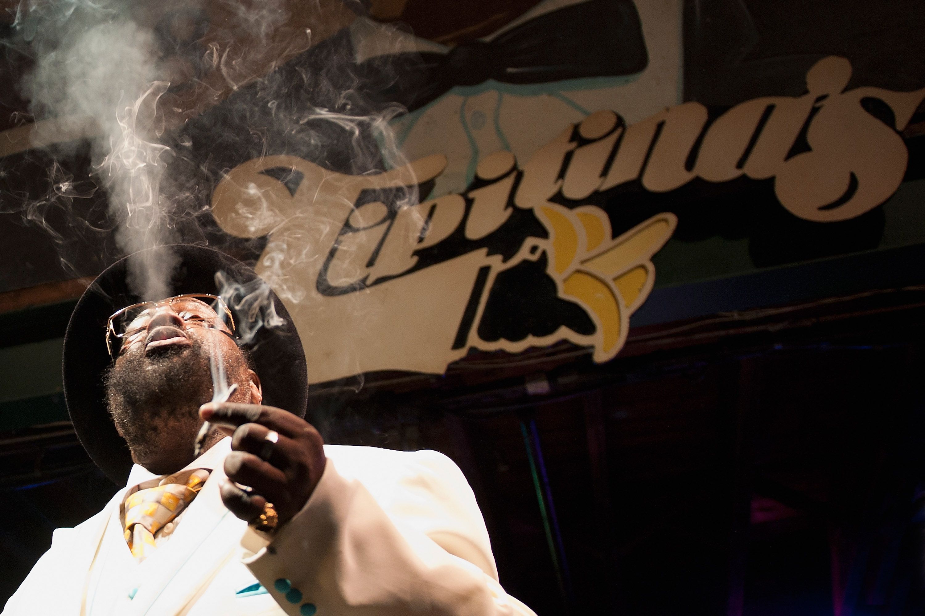 Photo shows George Clinton smoking a cigarette.