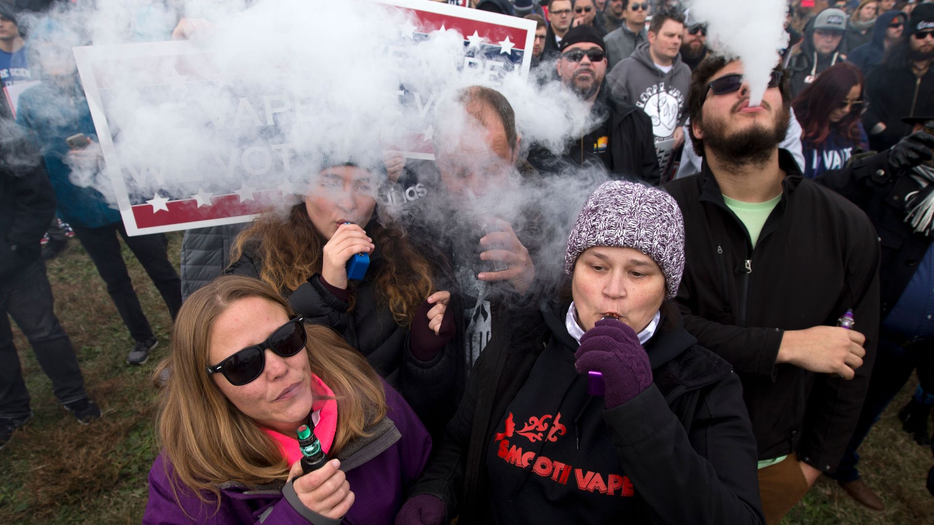 Demonstrators vape during a consumer advocate groups and vape storeowners rally outside of the White House to protest the proposed vaping flavor ban in Washington DC on November 9, 2019.