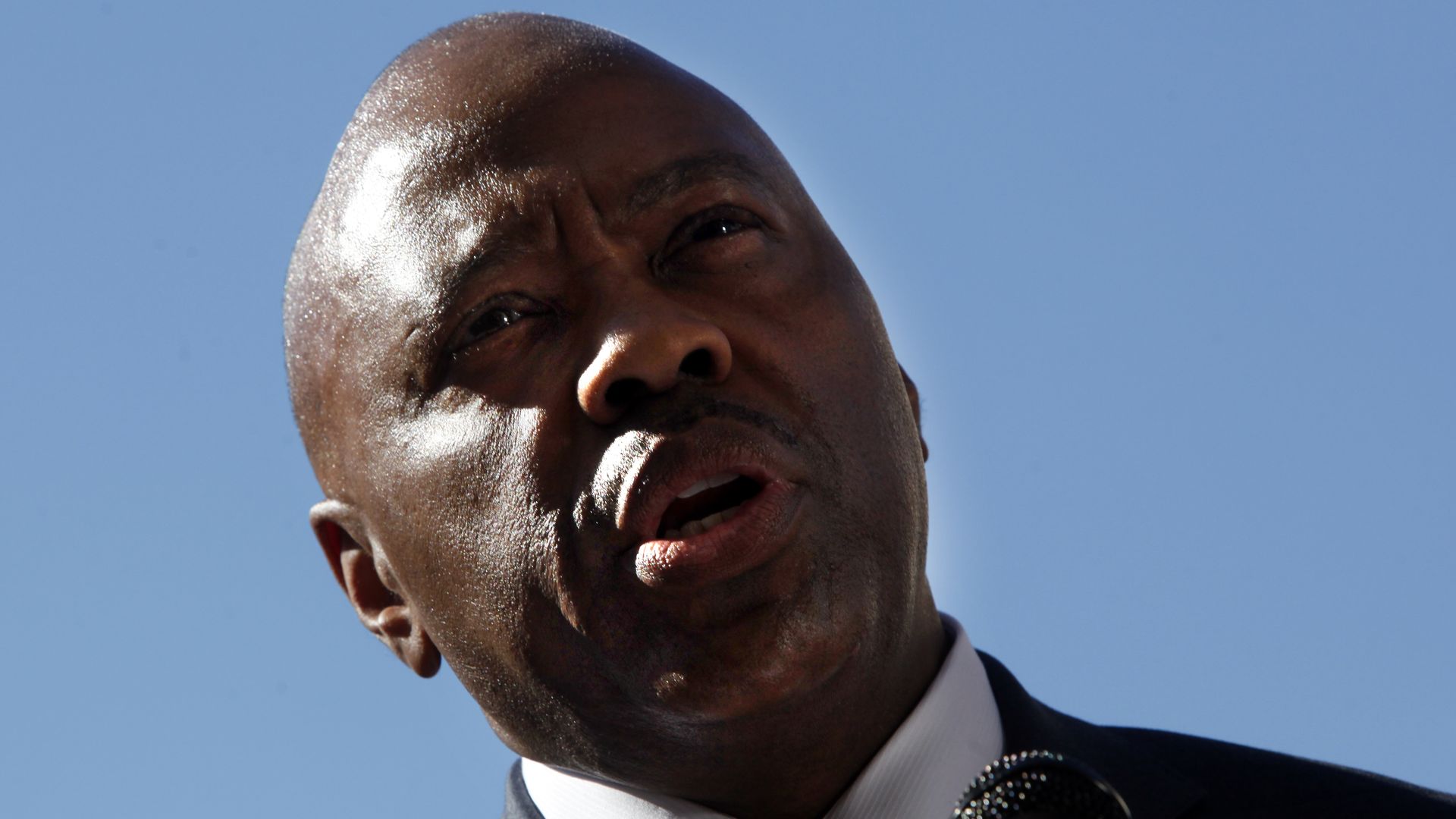 A photo of Phil Washington holding a microphone