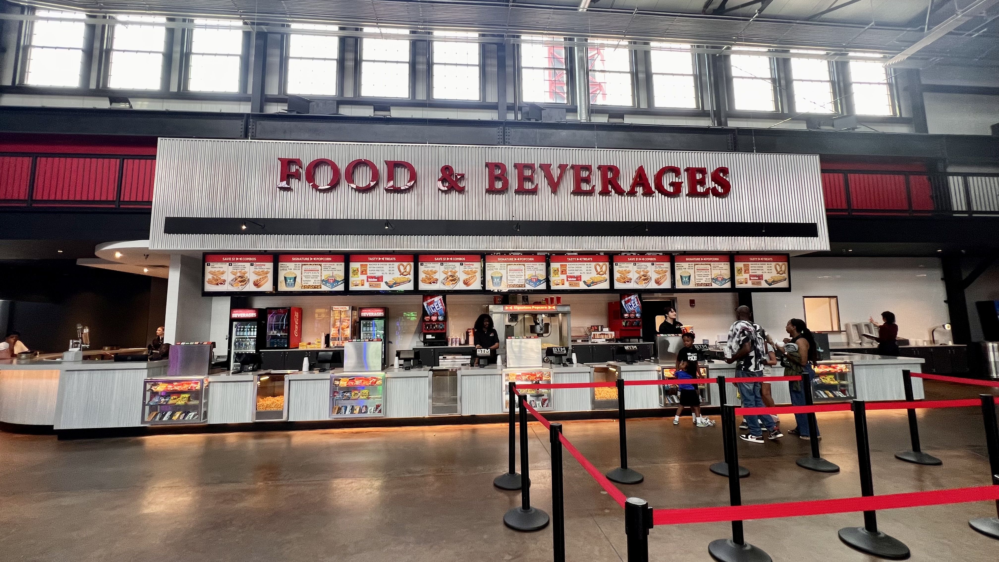 a pic of a concessions stand at the movie theater with the words "FOOD AND BEVERAGES" above it
