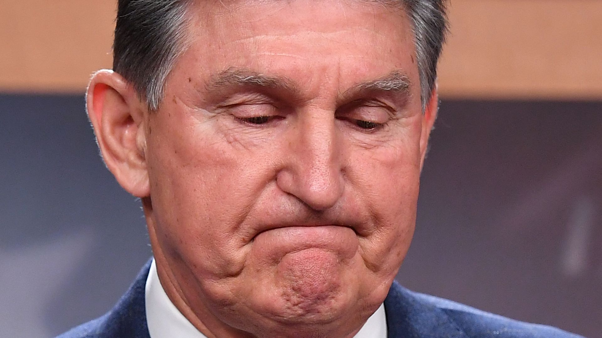 Sen. Joe Manchin is seen pausing while addressing reporters on Monday.