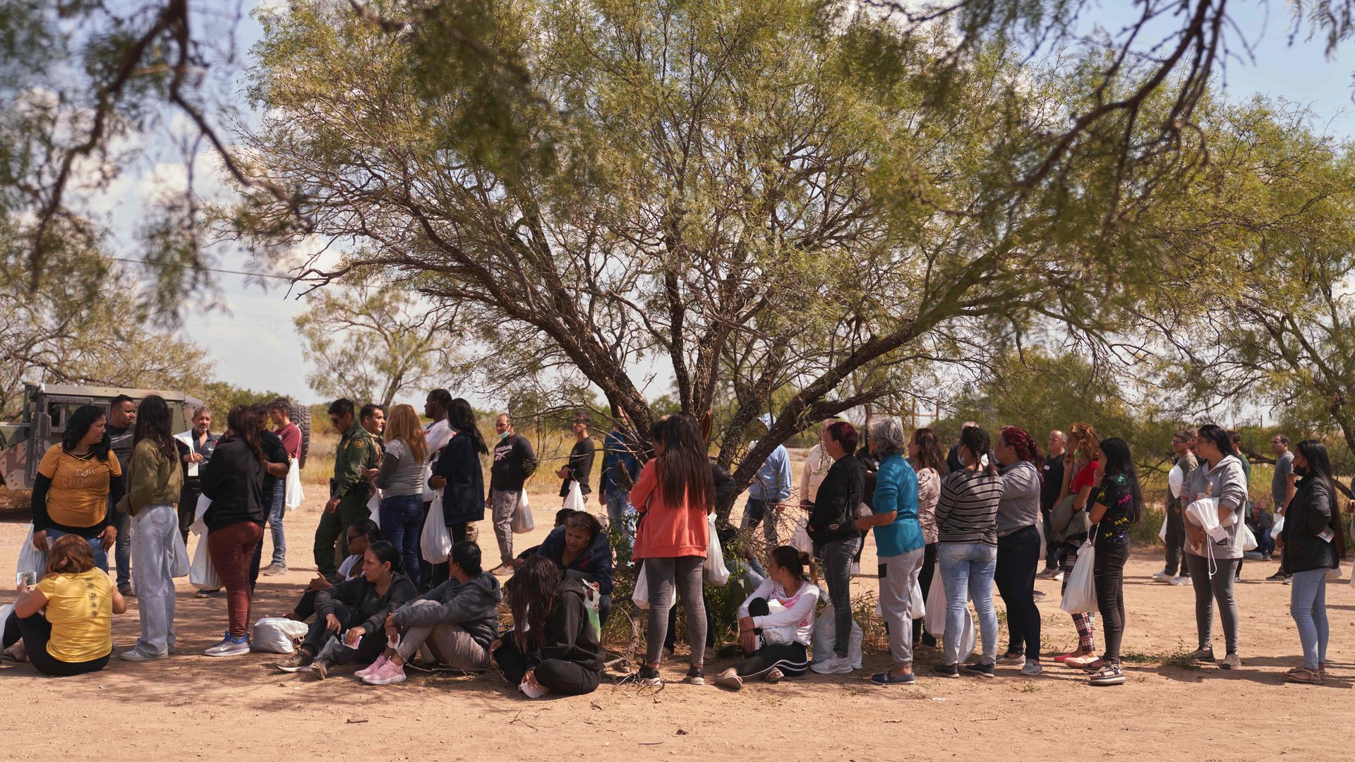 People near Eagle Pass, Texasm being processed by U.S. Border Patrol after crossing U.S. southern border illegally on Oct. 9.