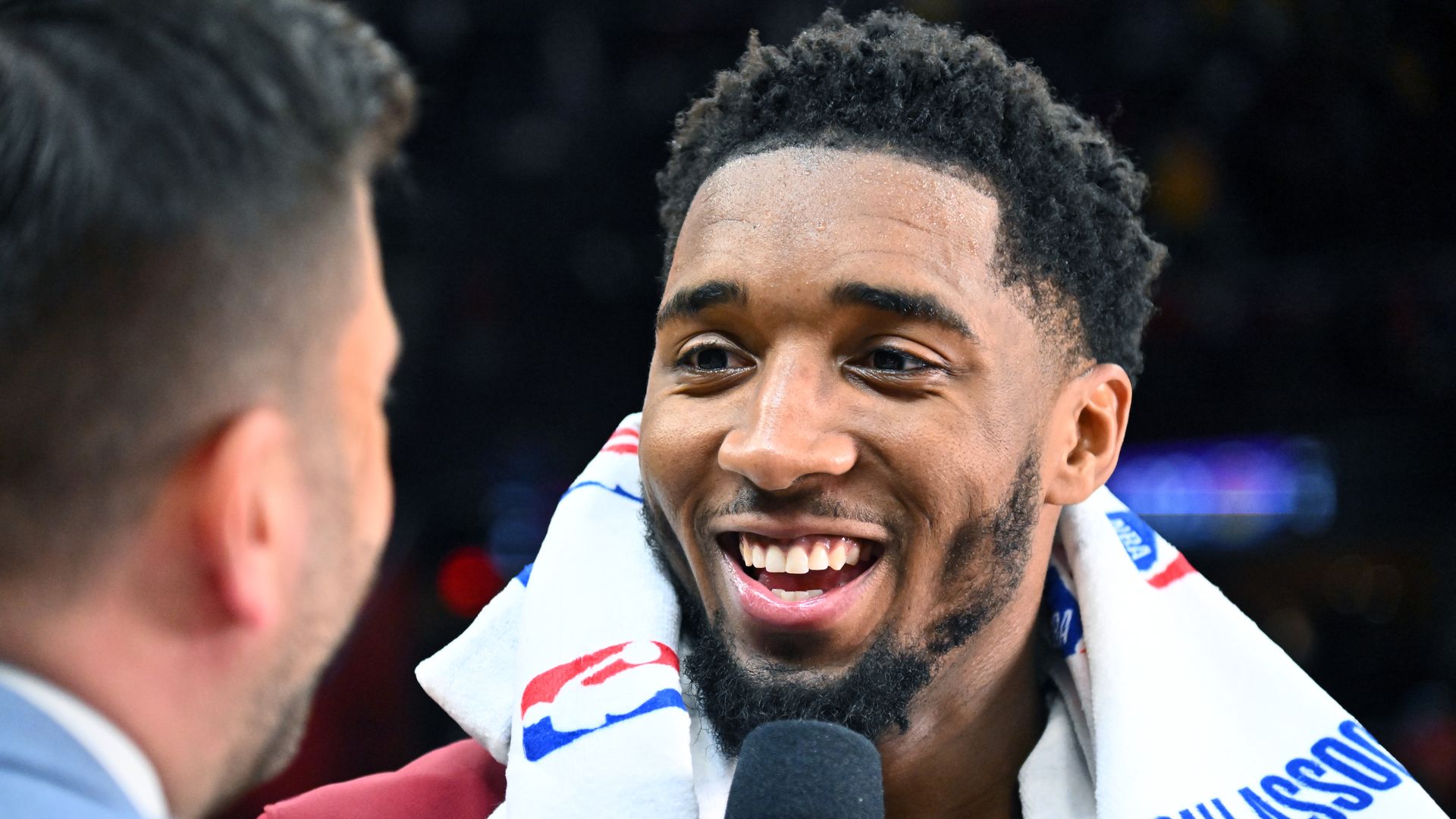 Donovan Mitchell interviews a reporter.