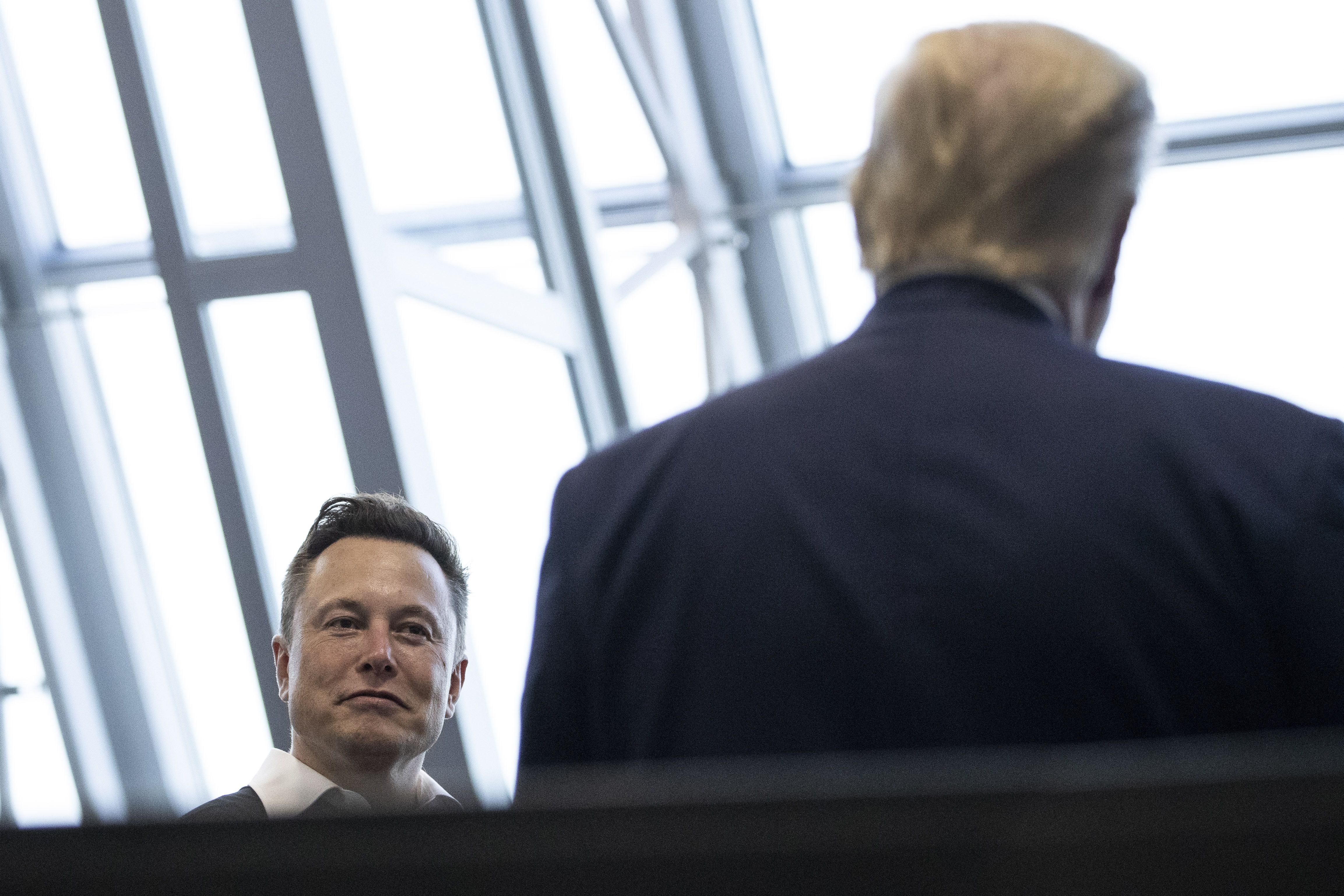 Elon Musk talks with then-President Trump after a 2020 SpaceX launch in Cape Canaveral, Fla.