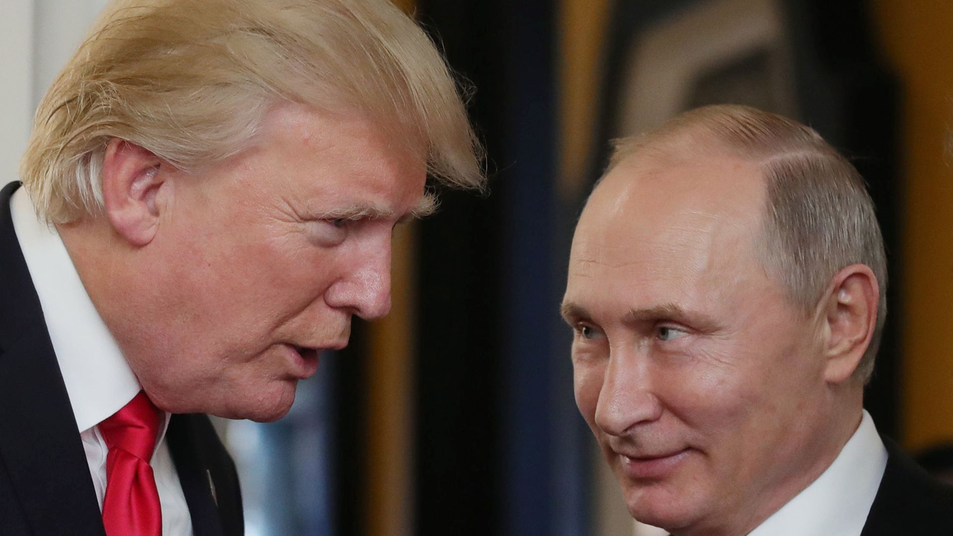 Donald Trump speaks to Vladimir Putin at close proximity.