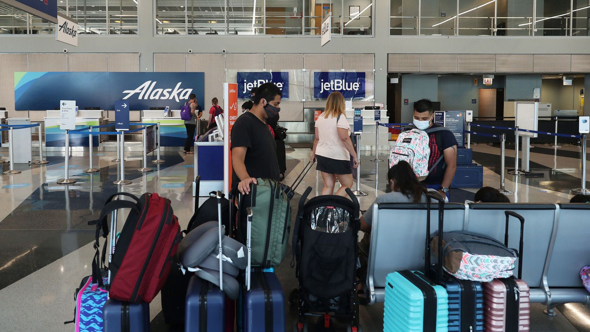 Travelers at Chicago O'Hare International Airport.