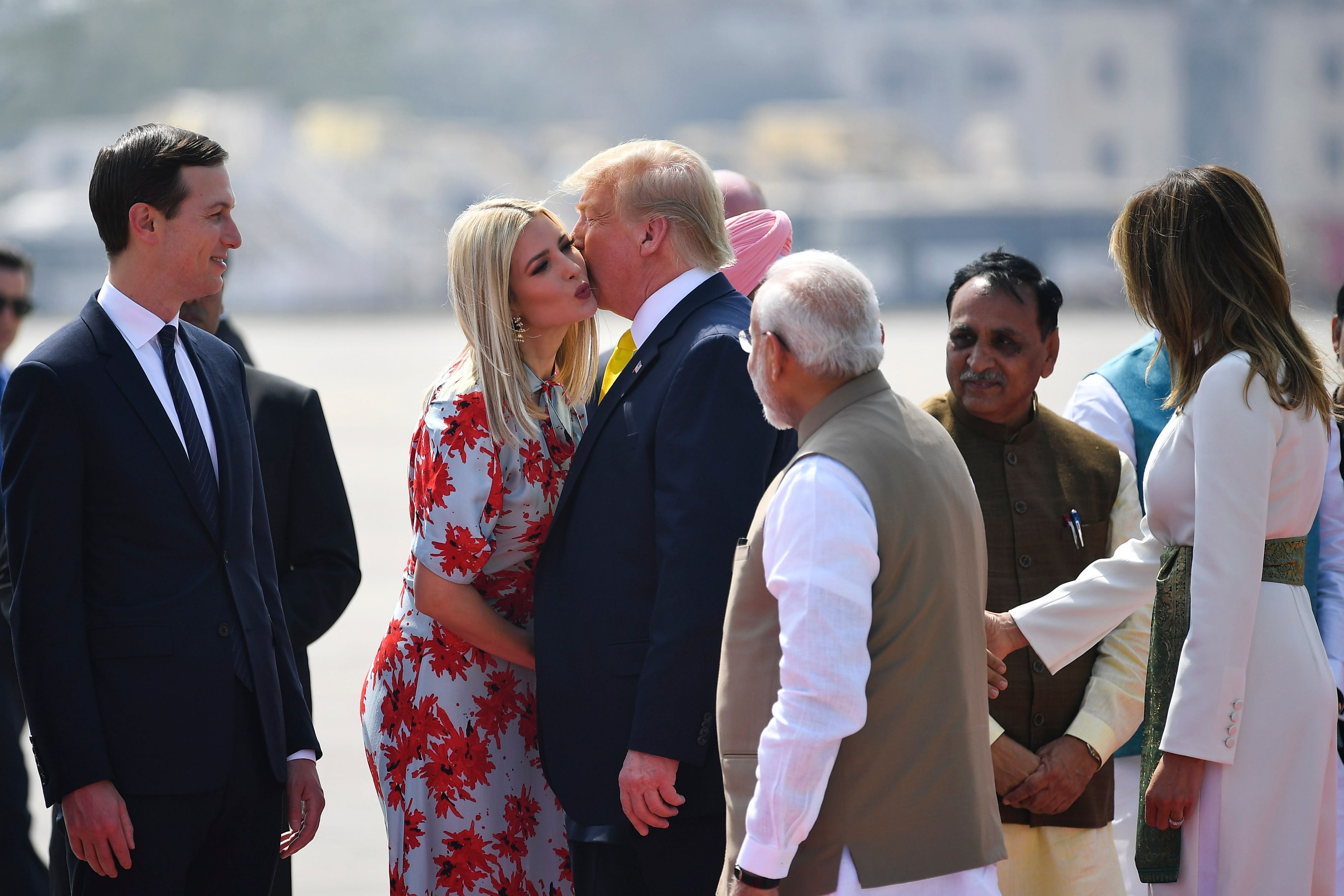  Trump (C) kisses White House senior advisor Ivanka Trump as India's Prime Minister Narendra Modi (R) looks 