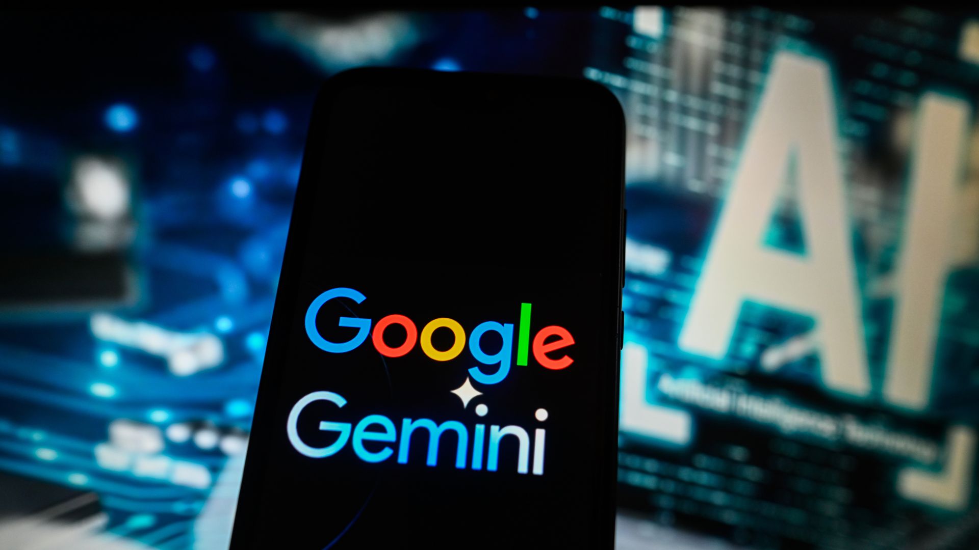 Google's logo is seen with its AI product Gemini's logo 