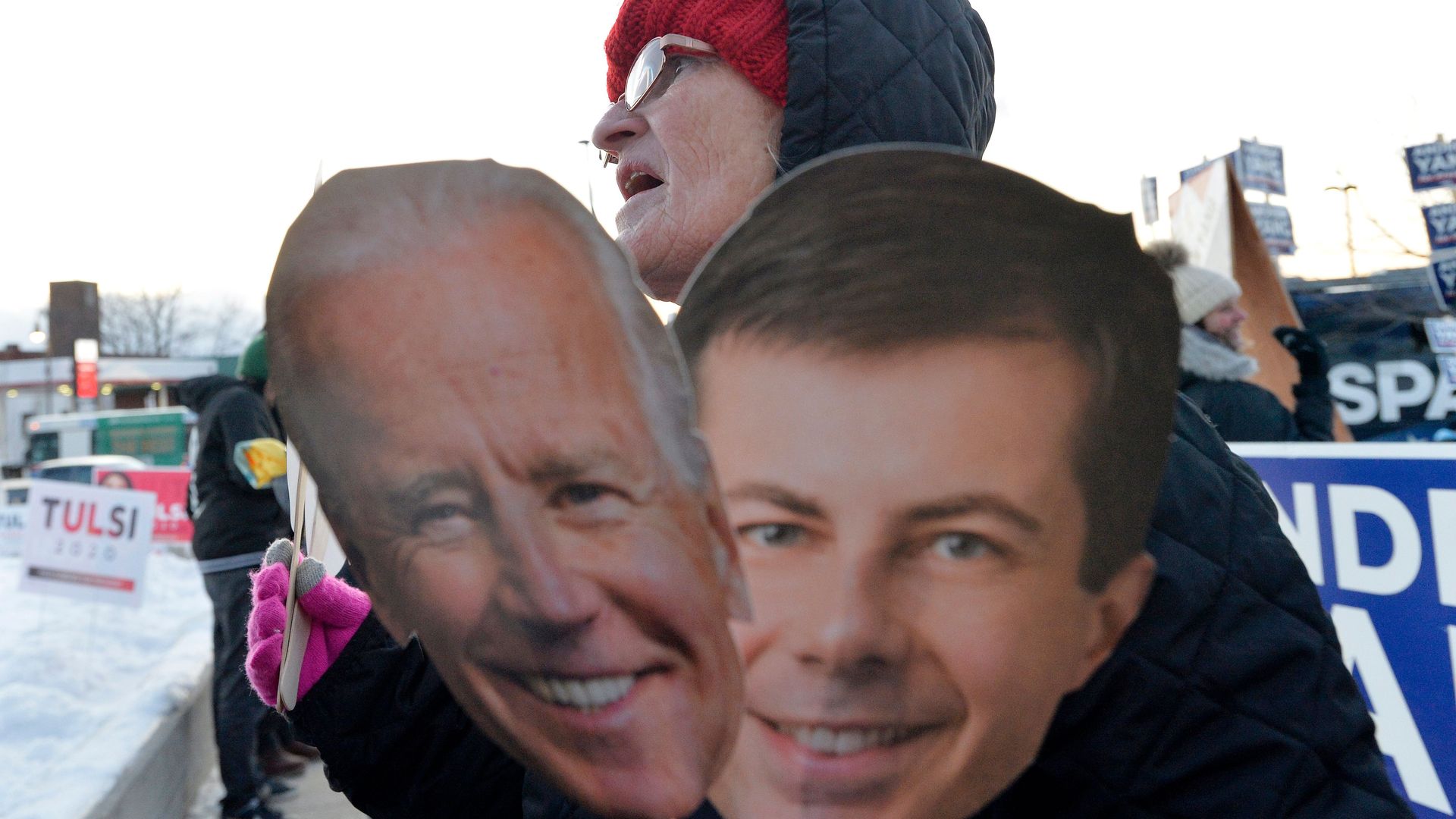 Katherine Miller, 55, sells US Democratic presidential candidate signs outside SNHU arena in Manchester, New Hampshire, on February 8