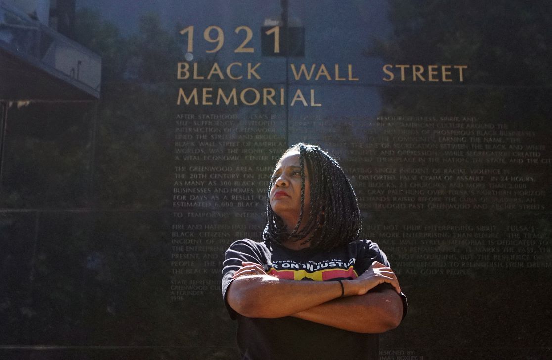 Tulsa City Council member Vanessa Hall-Harper poses in front of a monument to the 1921 Black Wall Street massacre.