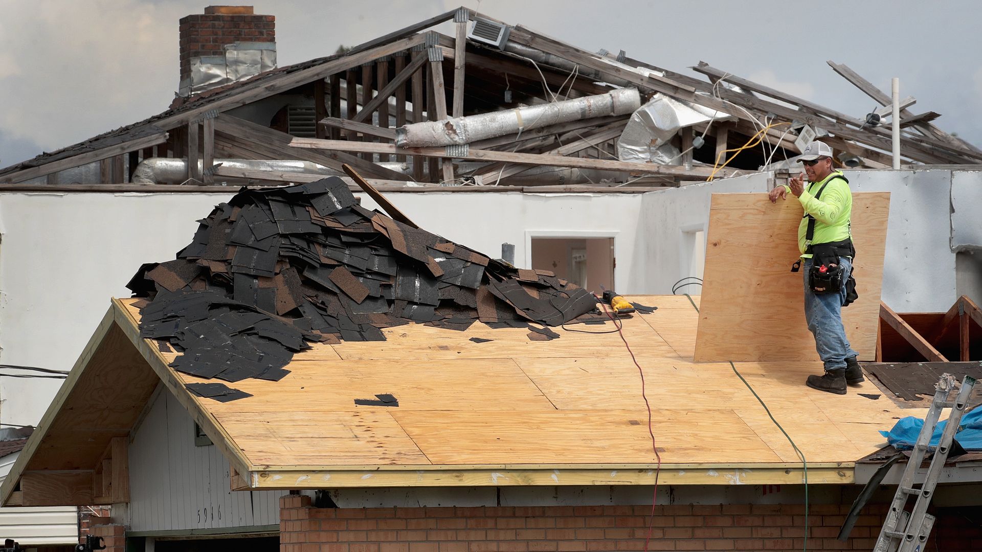 A man repairing hurricane-struck homes in the Panhandle.