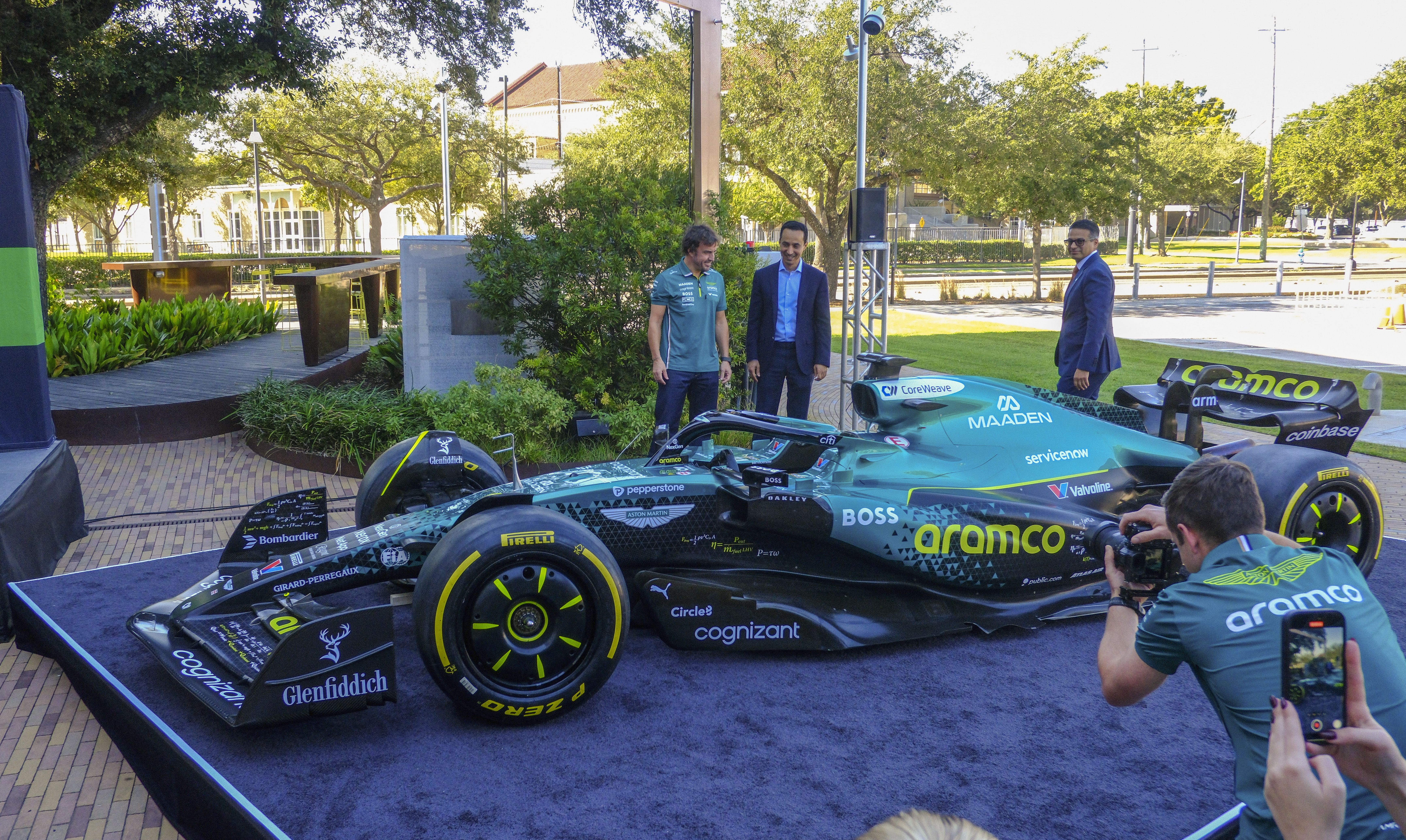 F1 driver Fernando Alonso and Aramco executives unveil new livery for AMF1's car in the U.S. Grand Prix