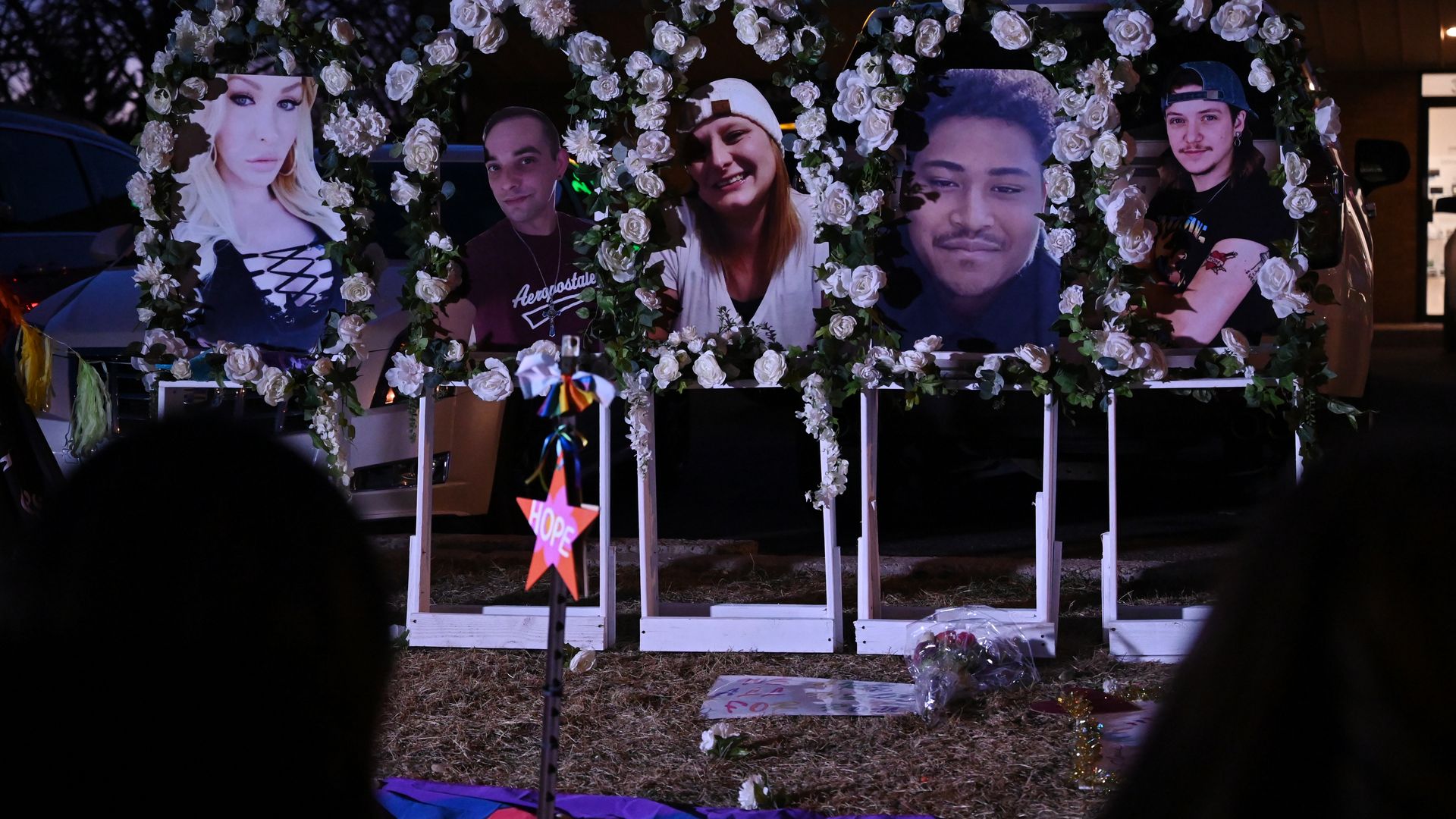 Photos of Club Q shooting victims are placed at a memorial in Colorado Springs. Photo: Hyoung Chang/The Denver Post