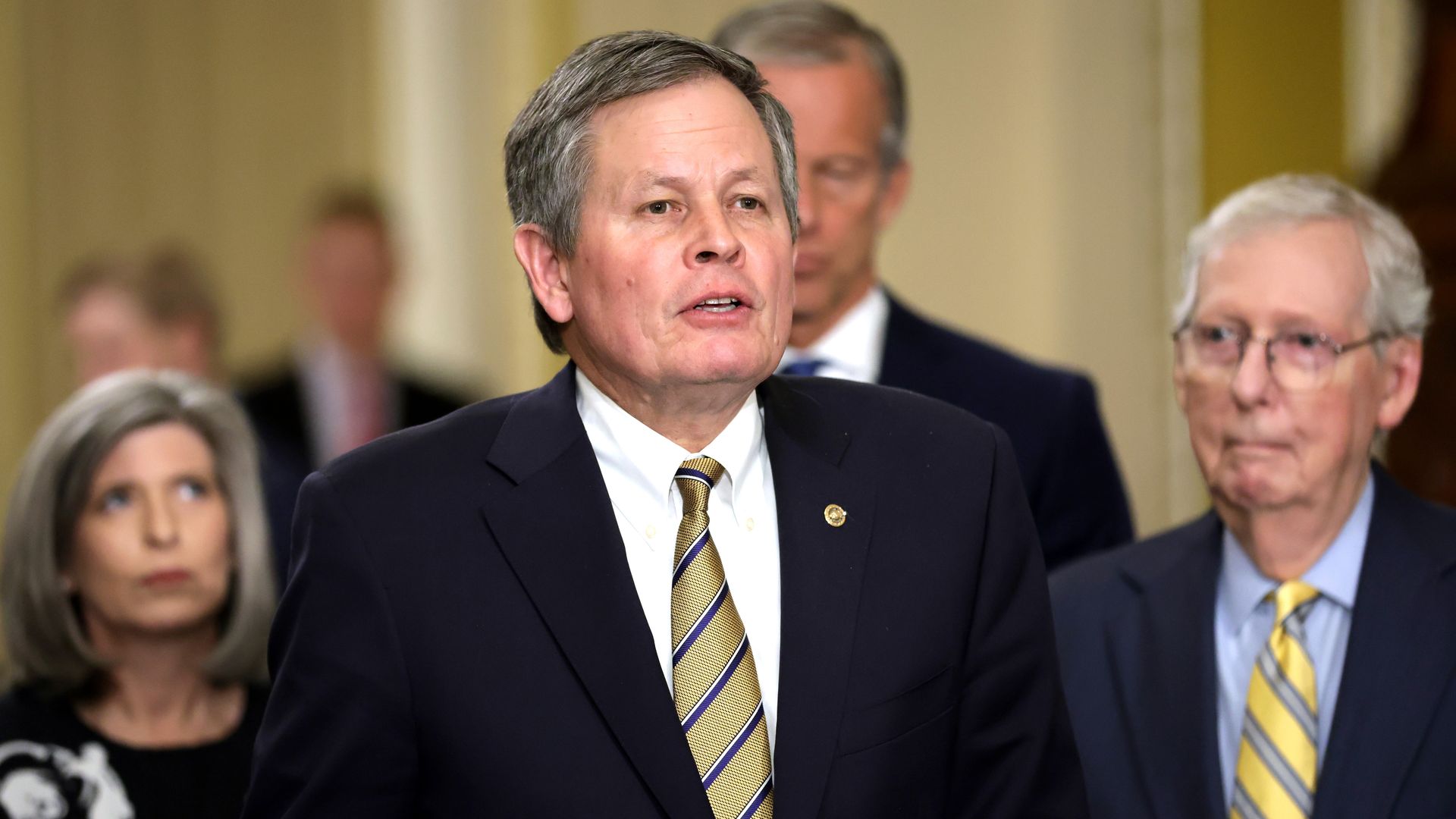 U.S. Steven Daines (R-MT) speaks to members of the press as Senate Minority Leader Sen. Mitch McConnell (R-KY) (R) and Sen. Joni Ernst (R-IA) (L) listen during a news briefing after a weekly Senate Republican policy luncheon at the U.S. Capitol on May 21, 2024 in Washington, DC.