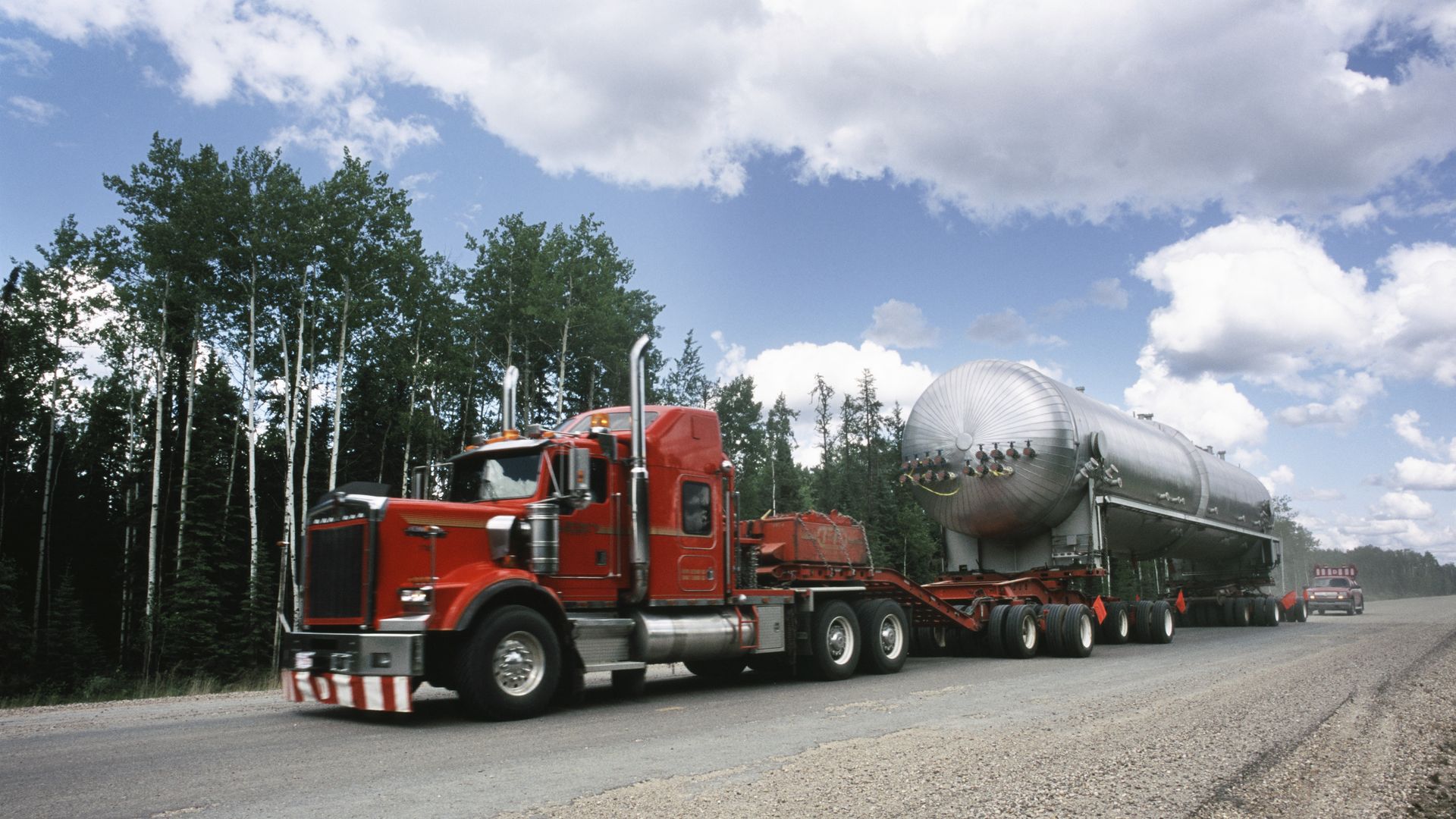 Truck on the forest highway in Alberta, Canada.