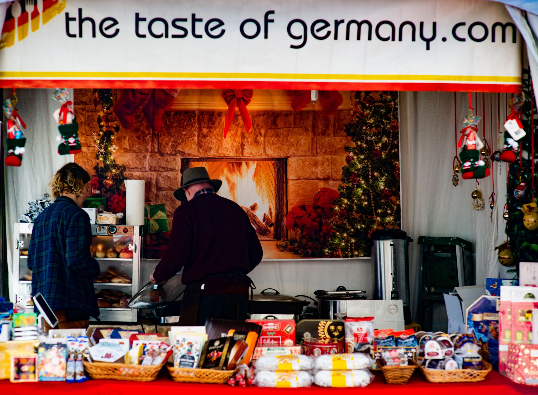 Vendors tend a fire at a holiday market 