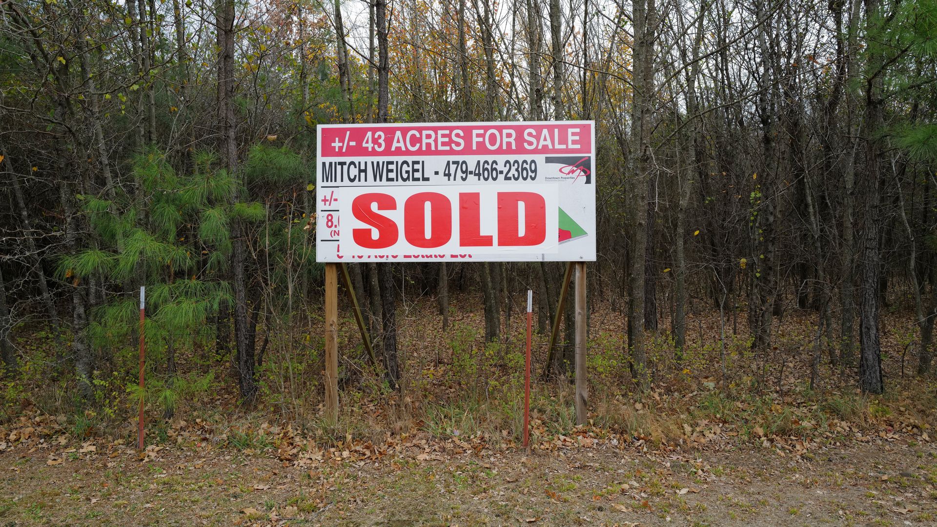 The for sale sign at the end of Rolling Hills Drive in Fayetteville. The woods will soon be homes. 