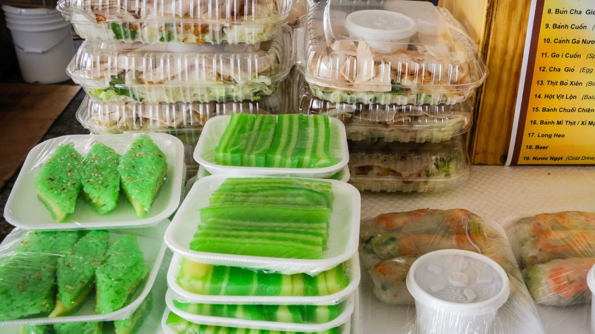 Photo shows Vietnamese food in containers.