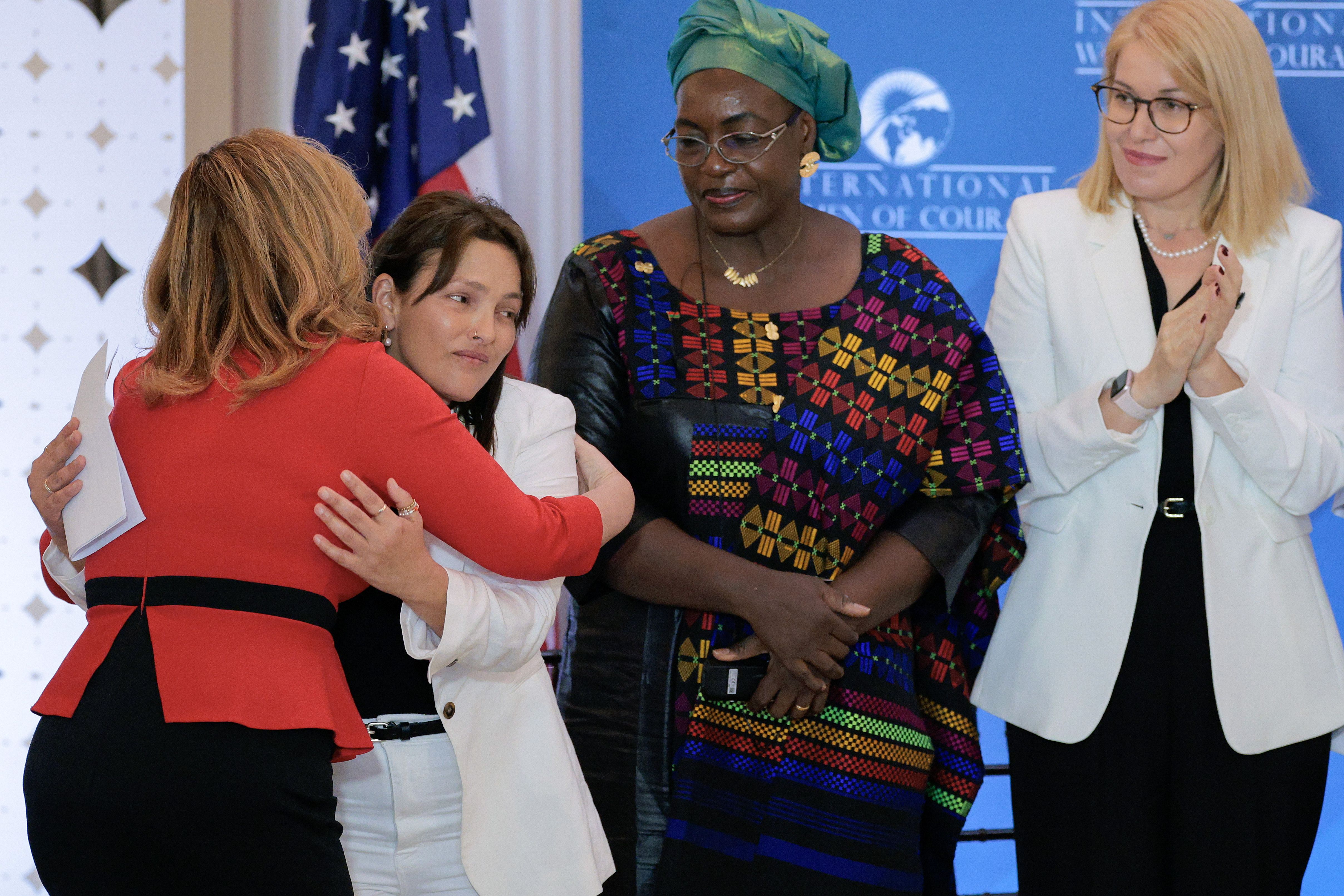  A hostage of the October 7th Hamas attack in Israel, Amit Soussana (2nd L) is embraced by Global Women's Issues Senior Bureau Official Katrina "Kat" Fotovat.
