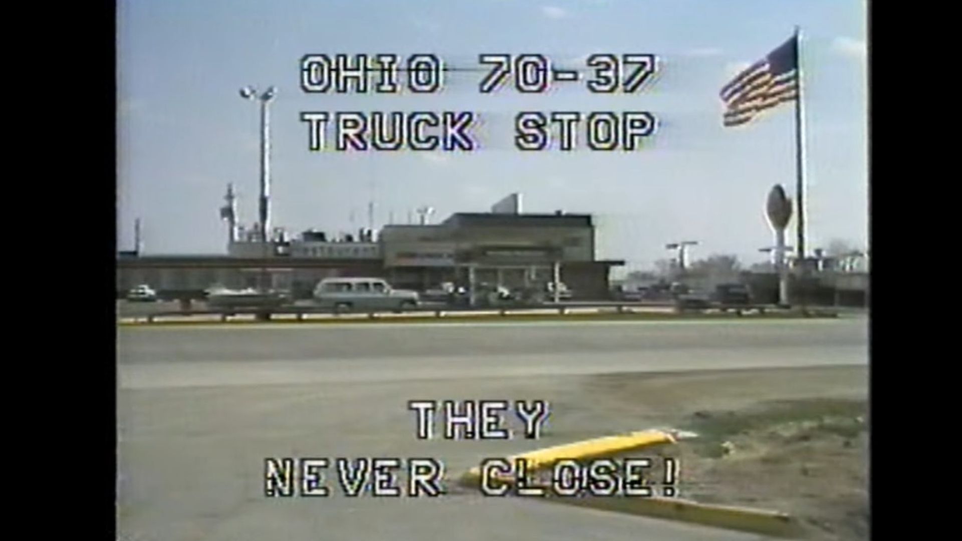 Screenshot of a 1980s commercial displaying a truck stop with the caption, "Ohio 70-37 Truck Stop, They Never Close"