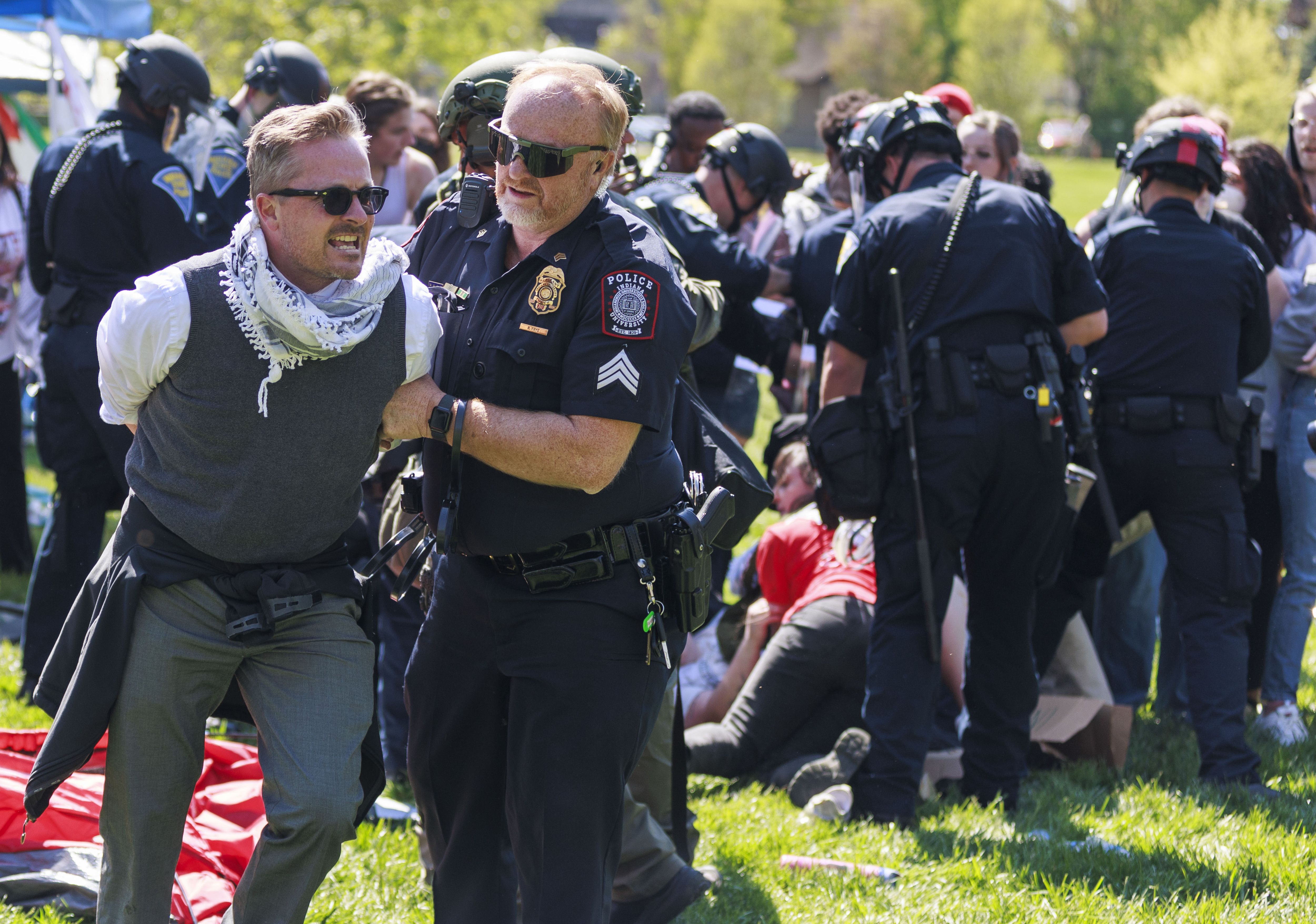 A police officer arresting protestors