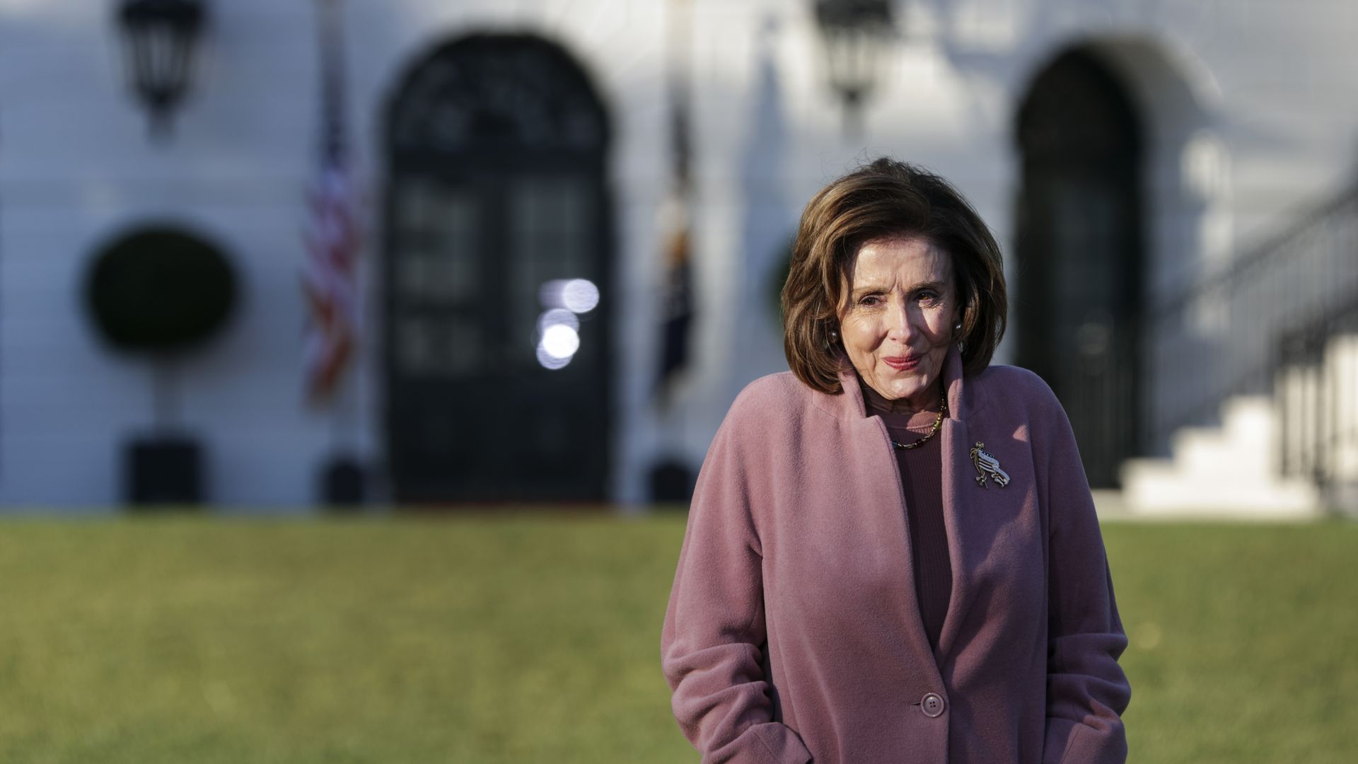 House Speaker Nancy Pelosi is seen smiling during the signing ceremony for the bipartisan infrastructure bill.