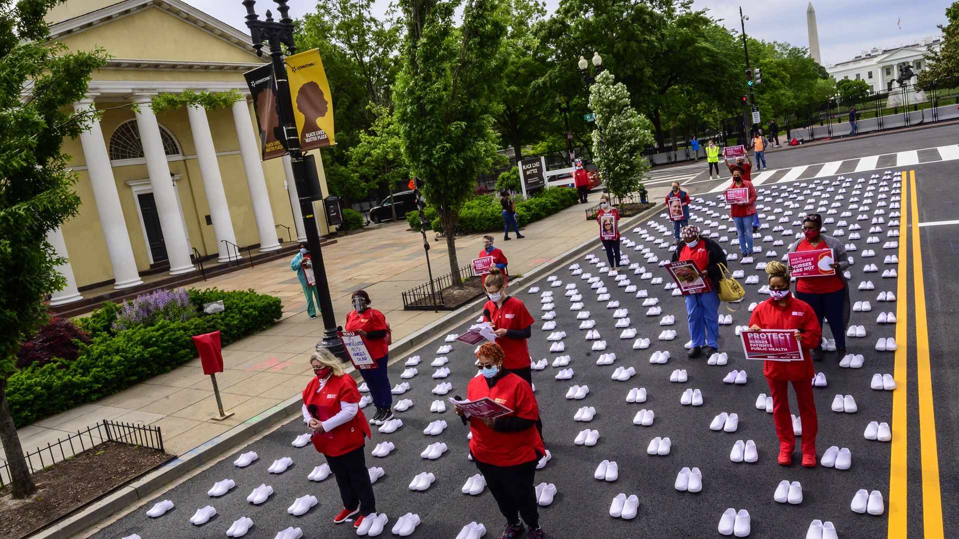 Members of the National Nurses United place 400 pairs of shoesto recognize the more than 400 registered nurses who have died from the Covid-19 pandemic on May 12, 2021 in Washington, DC