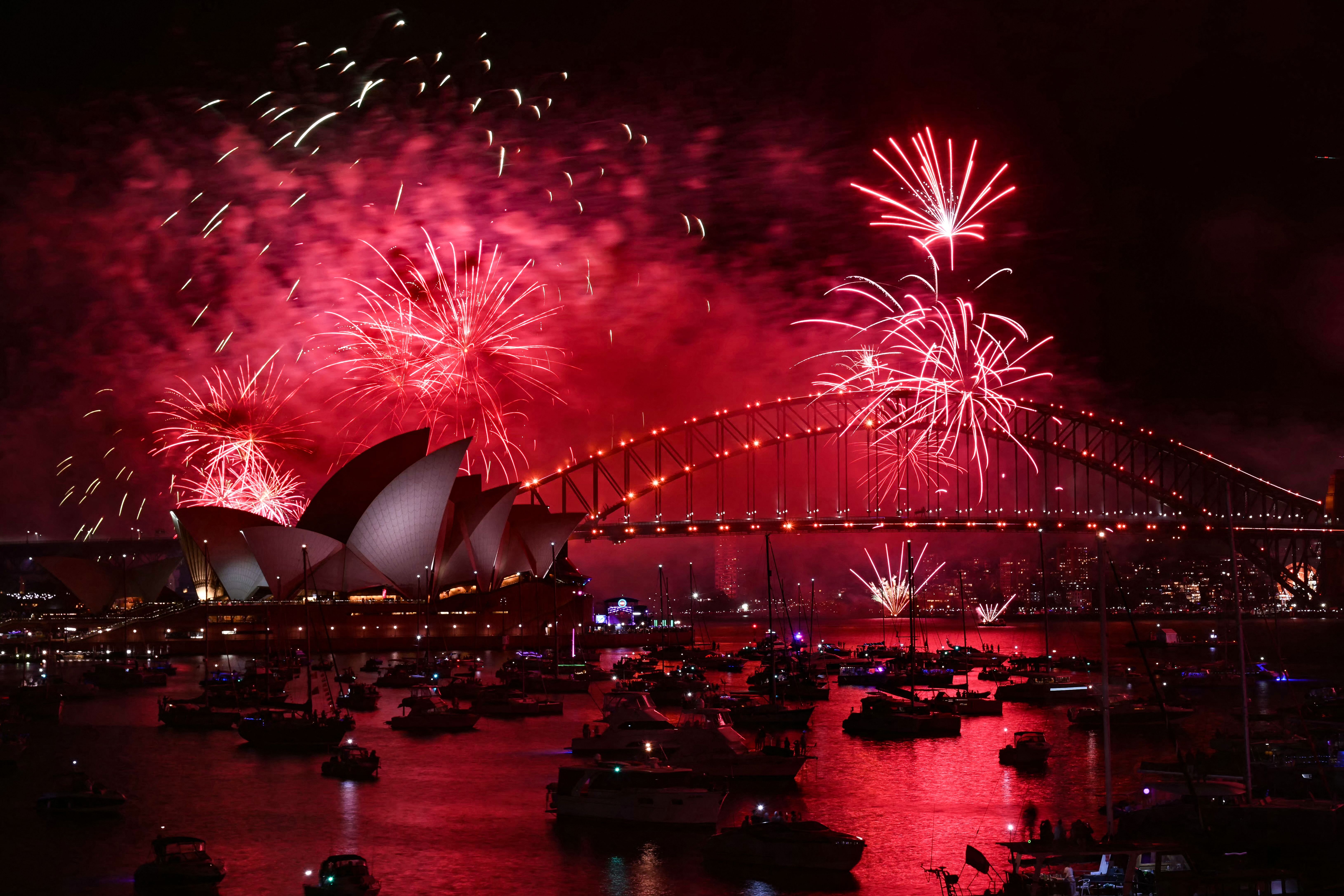 Fireworks light up the midnight sky over Sydney Harbour Bridge and Sydney Opera House during 2025 New Year's Day celebrations in Sydney on January 1, 2025.