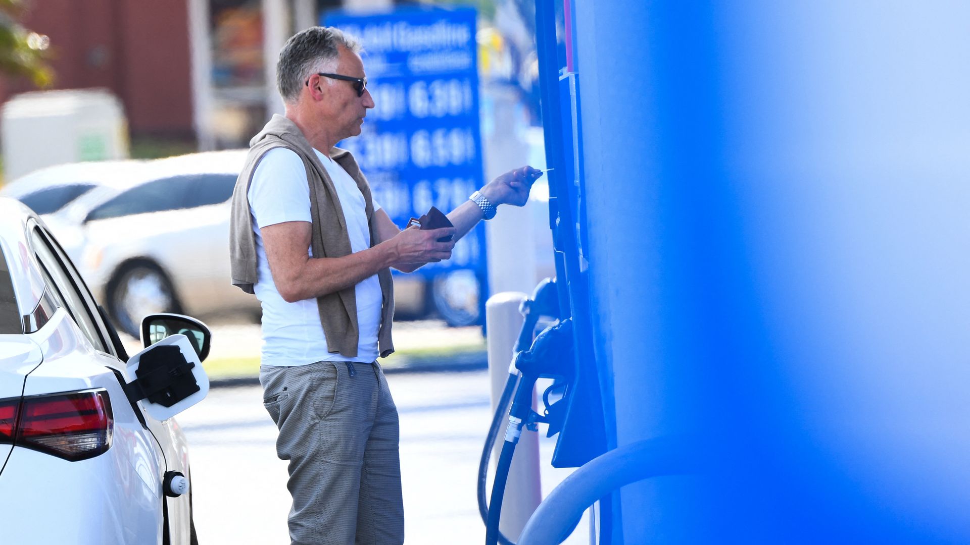 A person buying gas at a station in Los Angeles in April 2022.