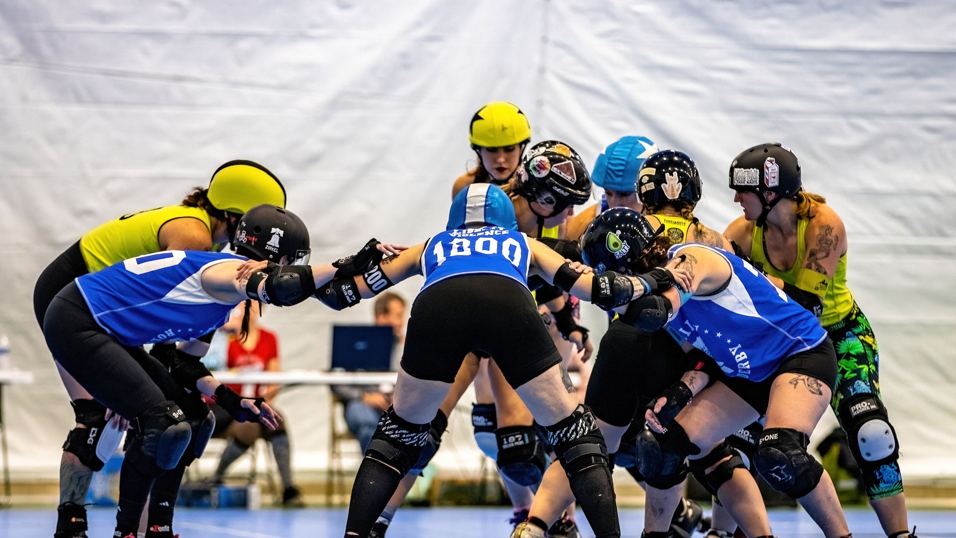 A scrum of participants at one of Philly's women's roller derby competitions. 