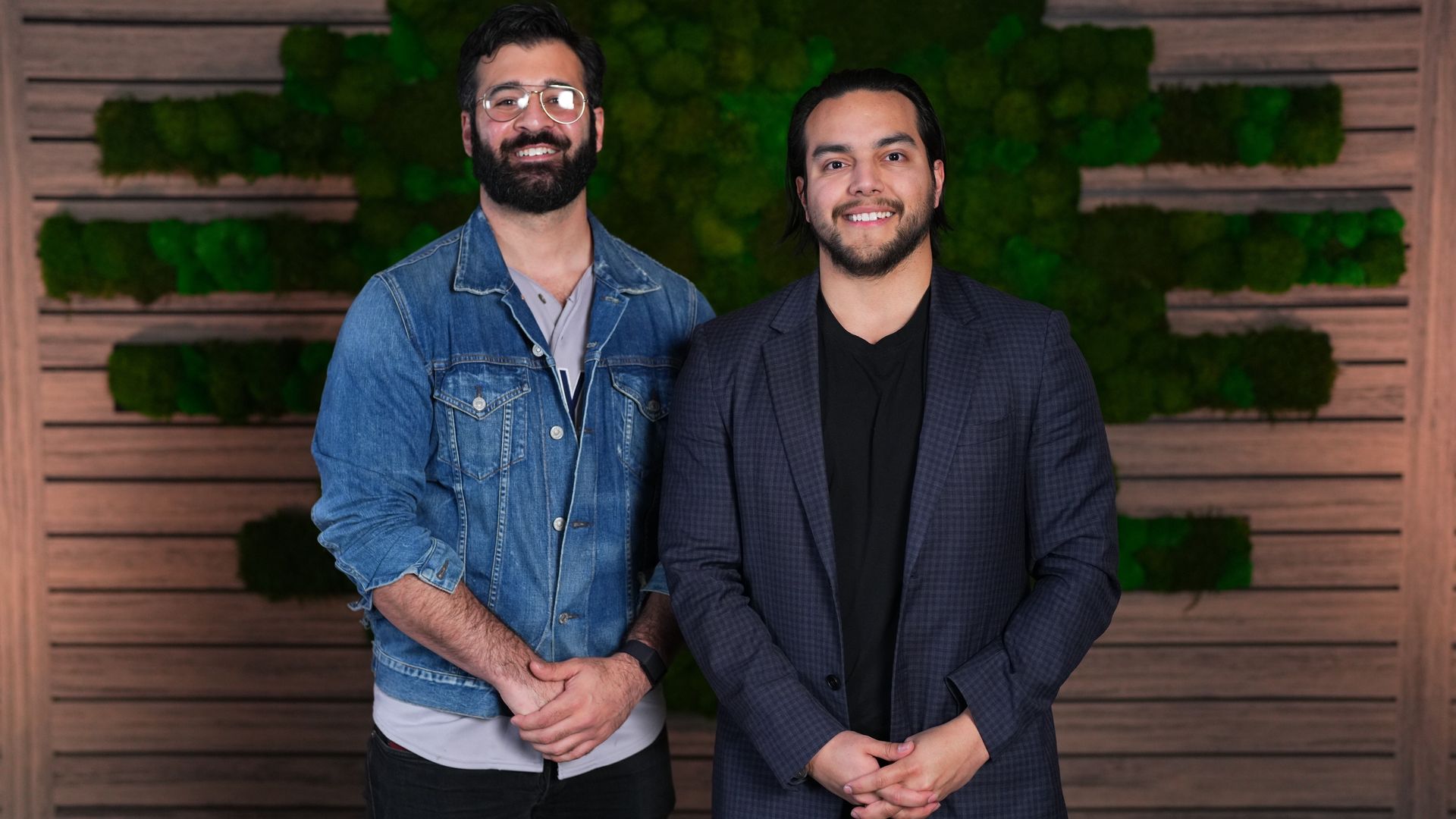 Two cofounders of a new educational website stand side by side